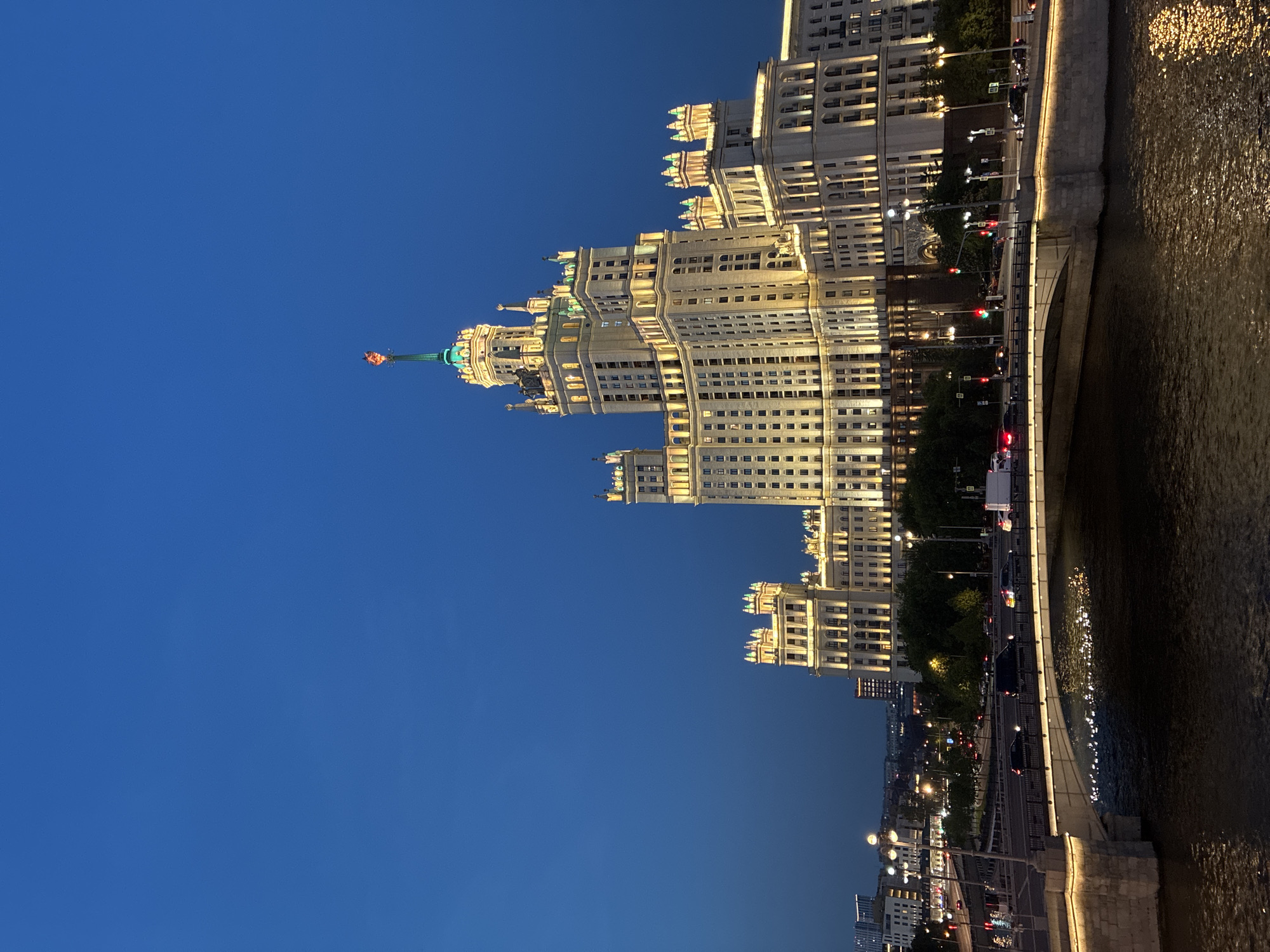 Moscow's Kotelnicheskaya Building illuminated against evening sky