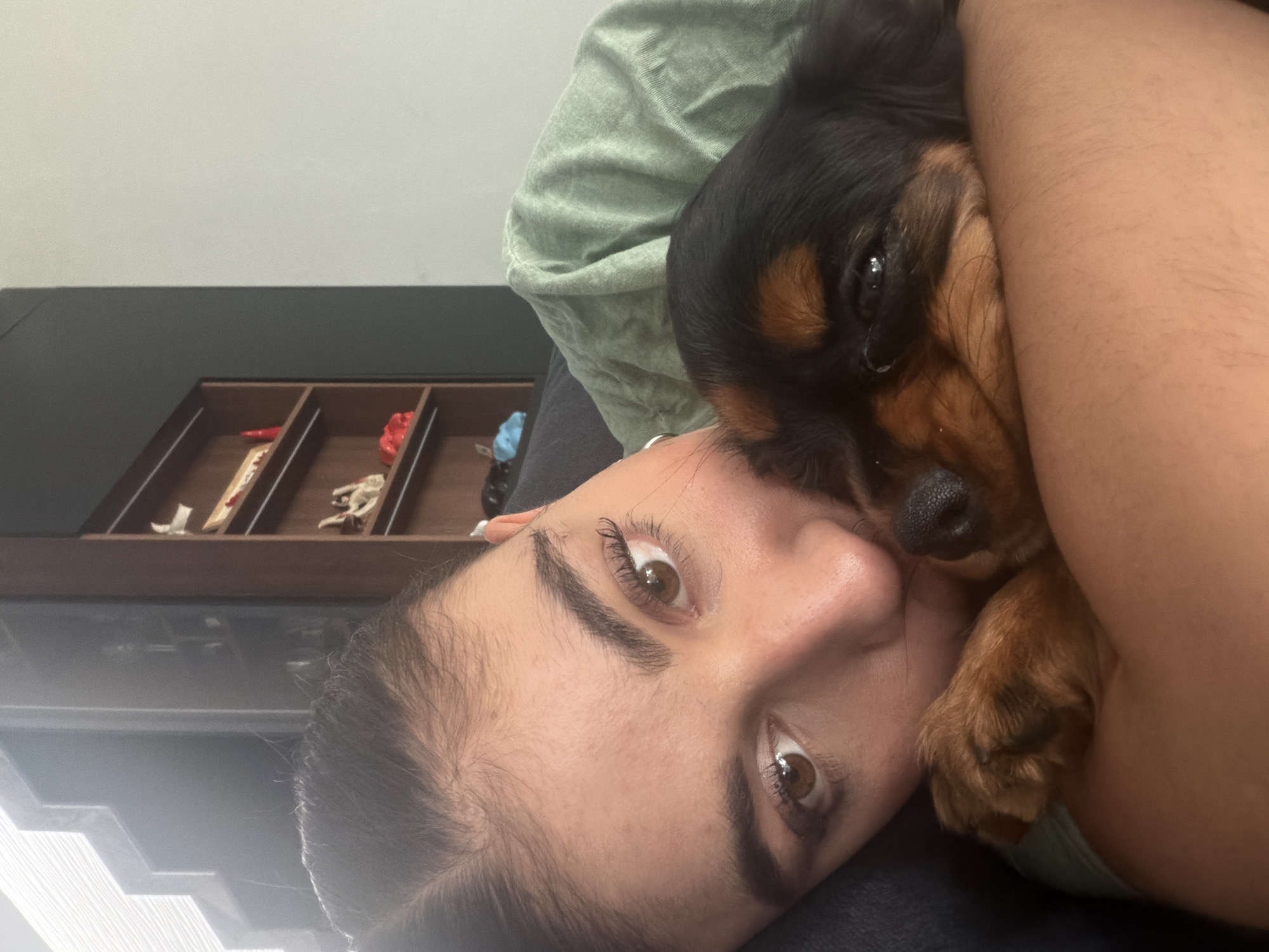 Woman cuddles small dog in quiet moment, Puebla