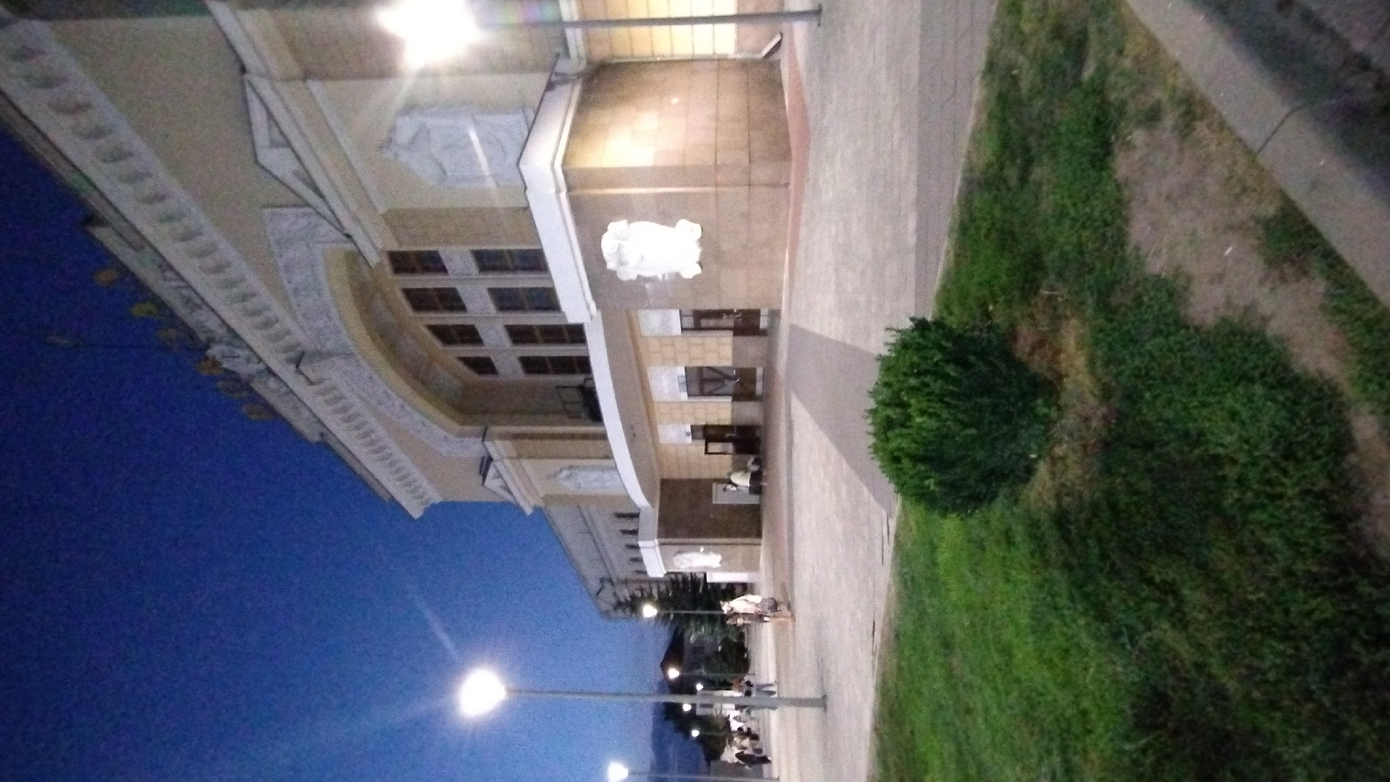 Train travel into an Eastern European city at dusk
