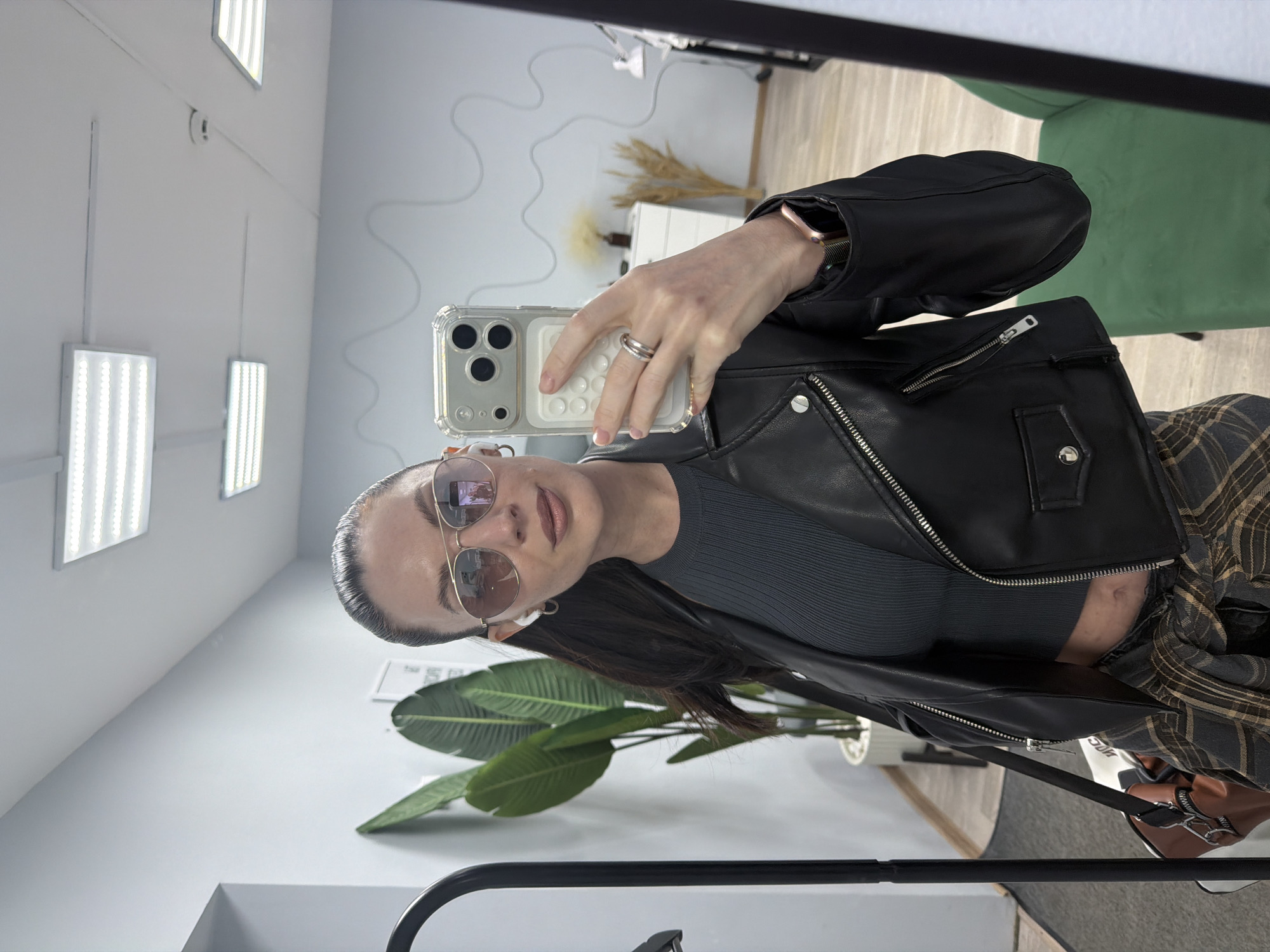 Woman takes selfies indoors in Perm, Russia