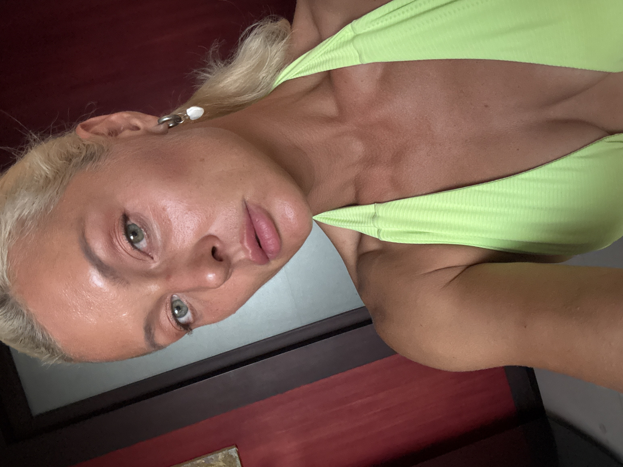 Outdoor close-up portrait with green eyes and blonde hair