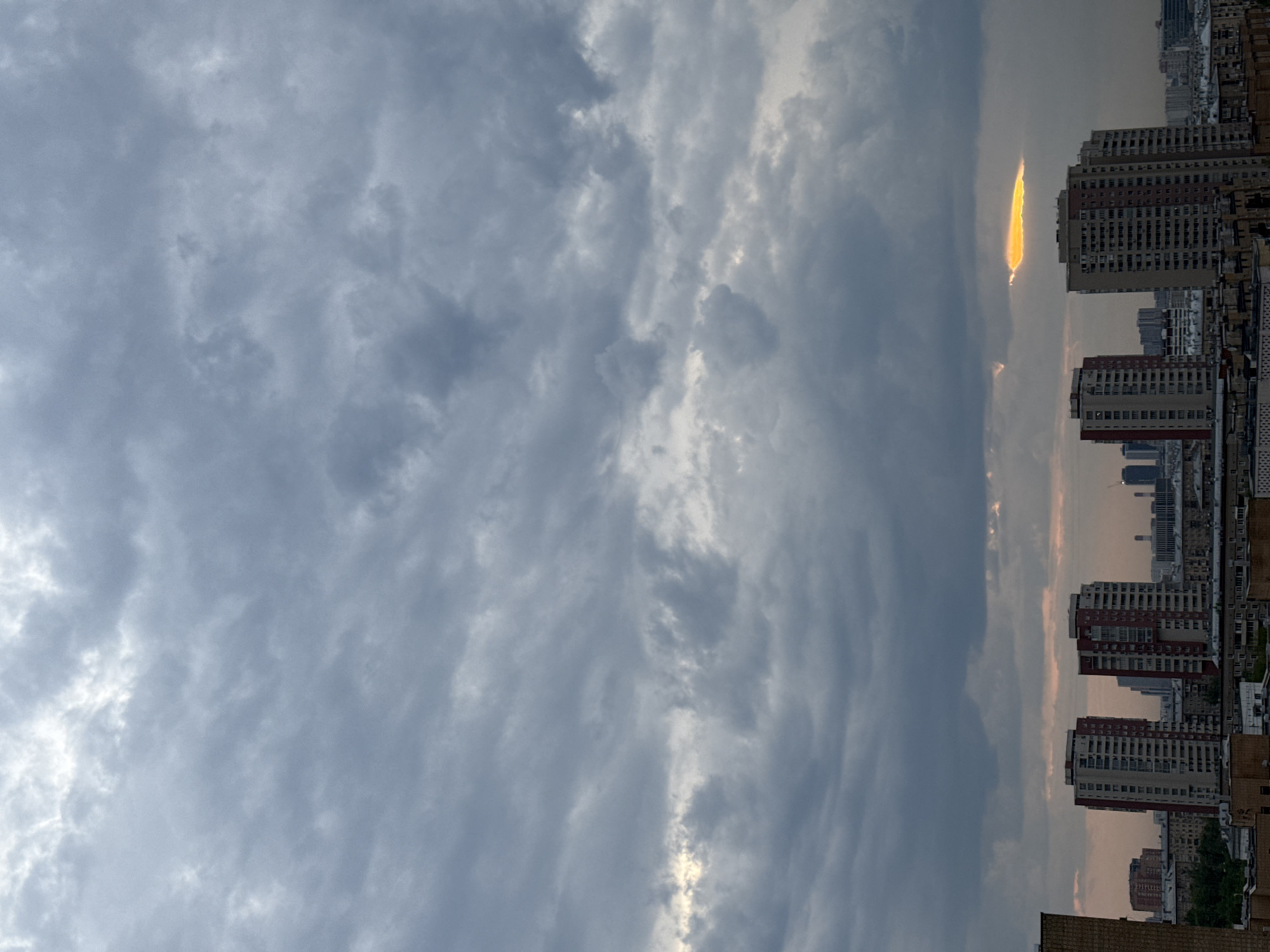 Dramatic sunset breaks through storm clouds over Moscow skyline