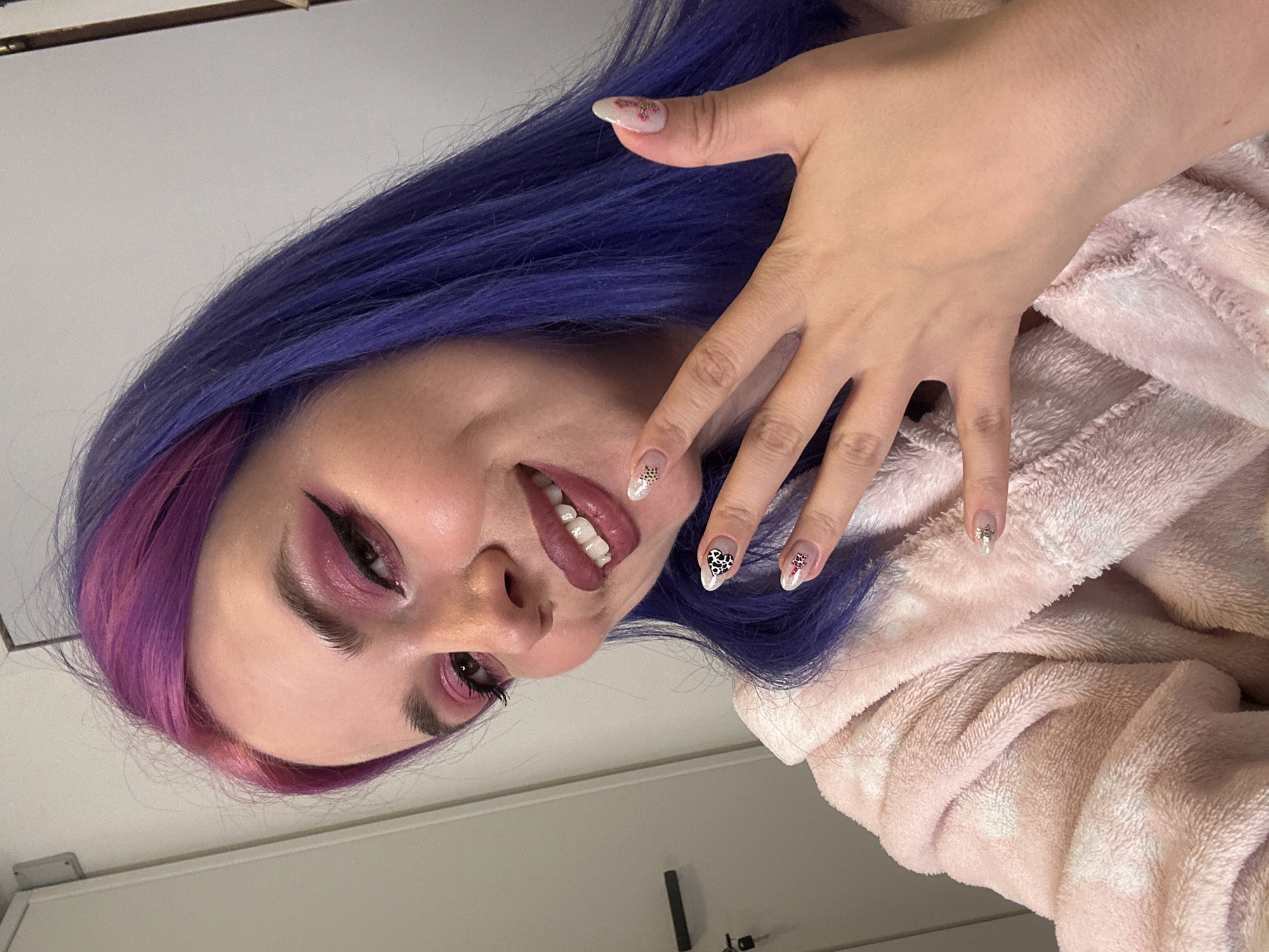 Woman showcases colorful nail art in Zagreb selfie session