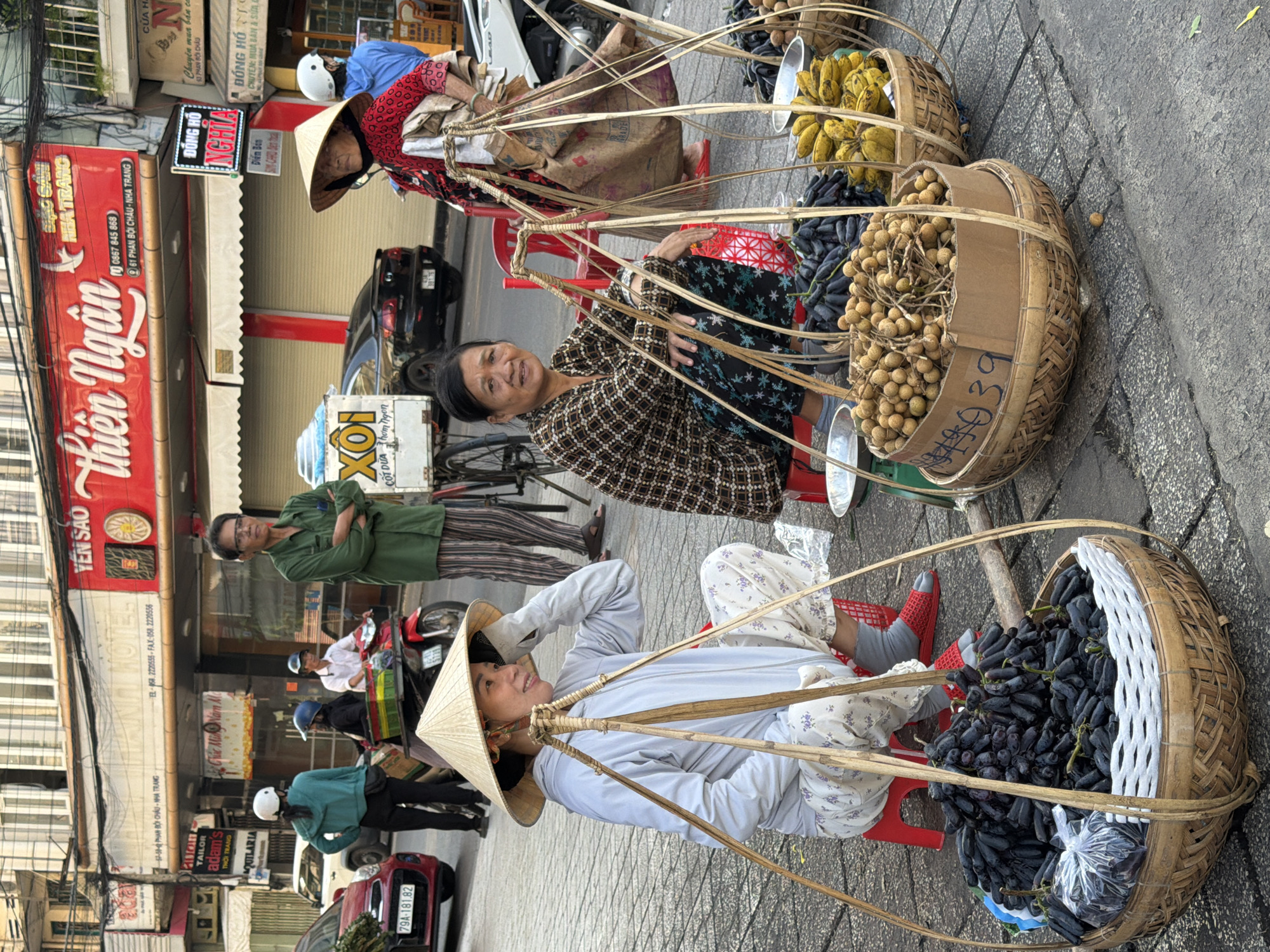Street vendors, scooters, and daily commerce in Nha Trang