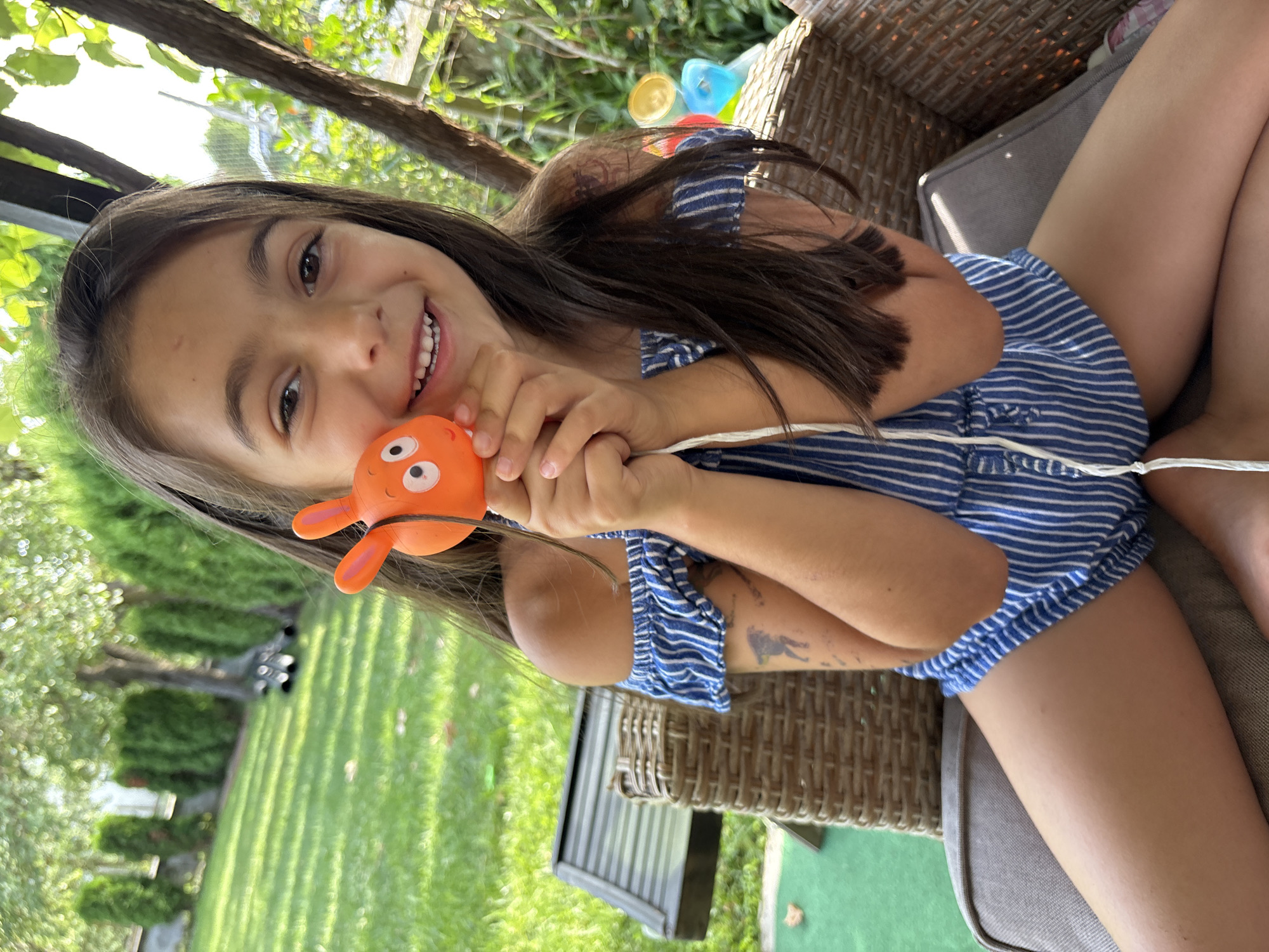 Backyard afternoon in Oreshak with a rabbit toy