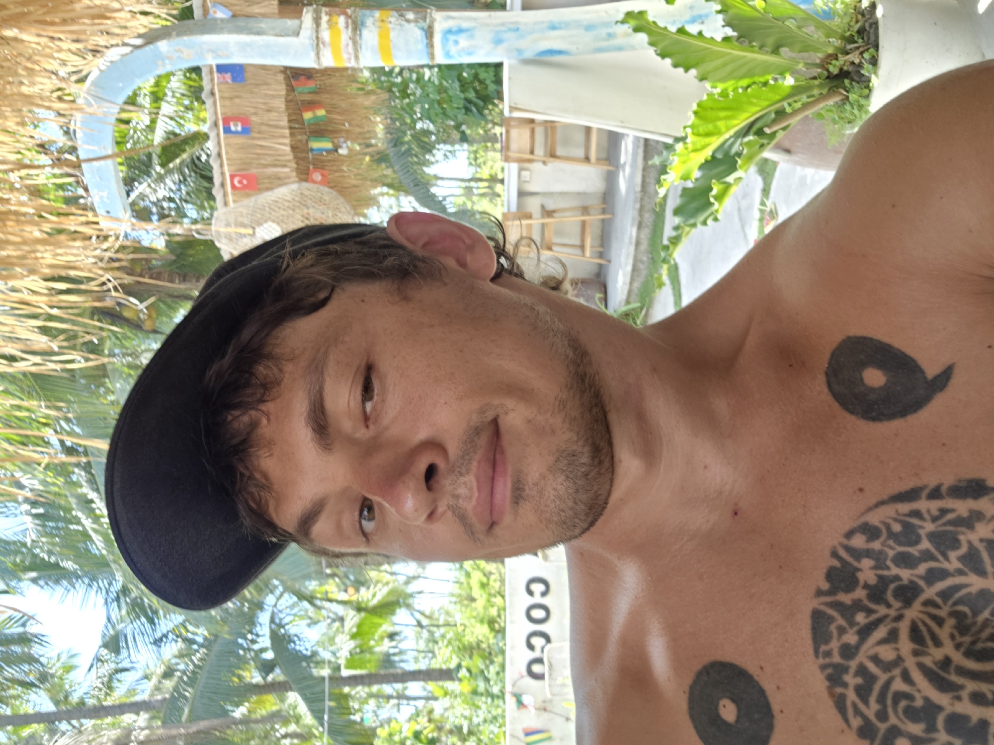 Tattooed man photographed multiple times in Nusa Penida