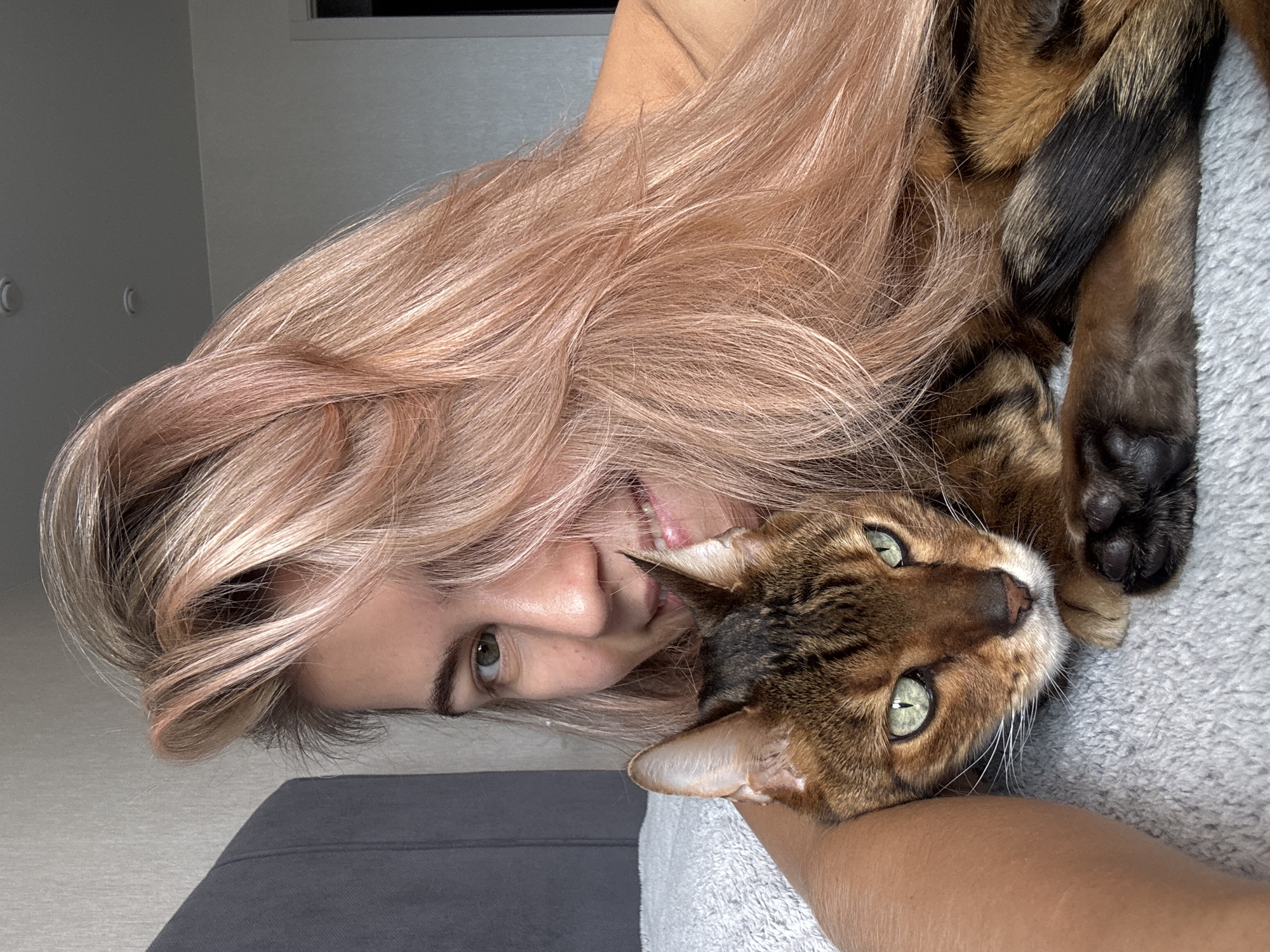Woman spends morning with Bengal cat at home