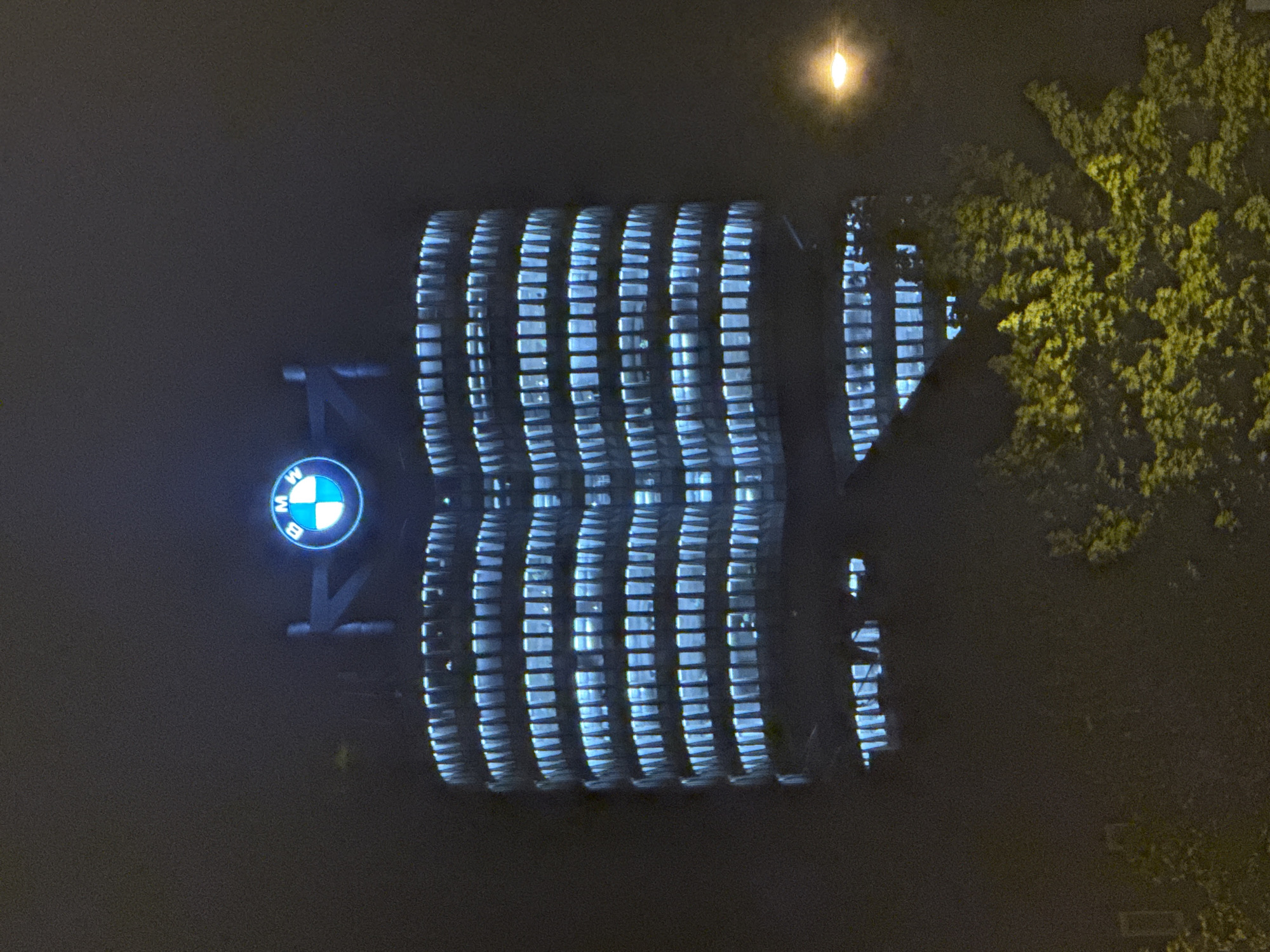 BMW Munich headquarters glows blue at night