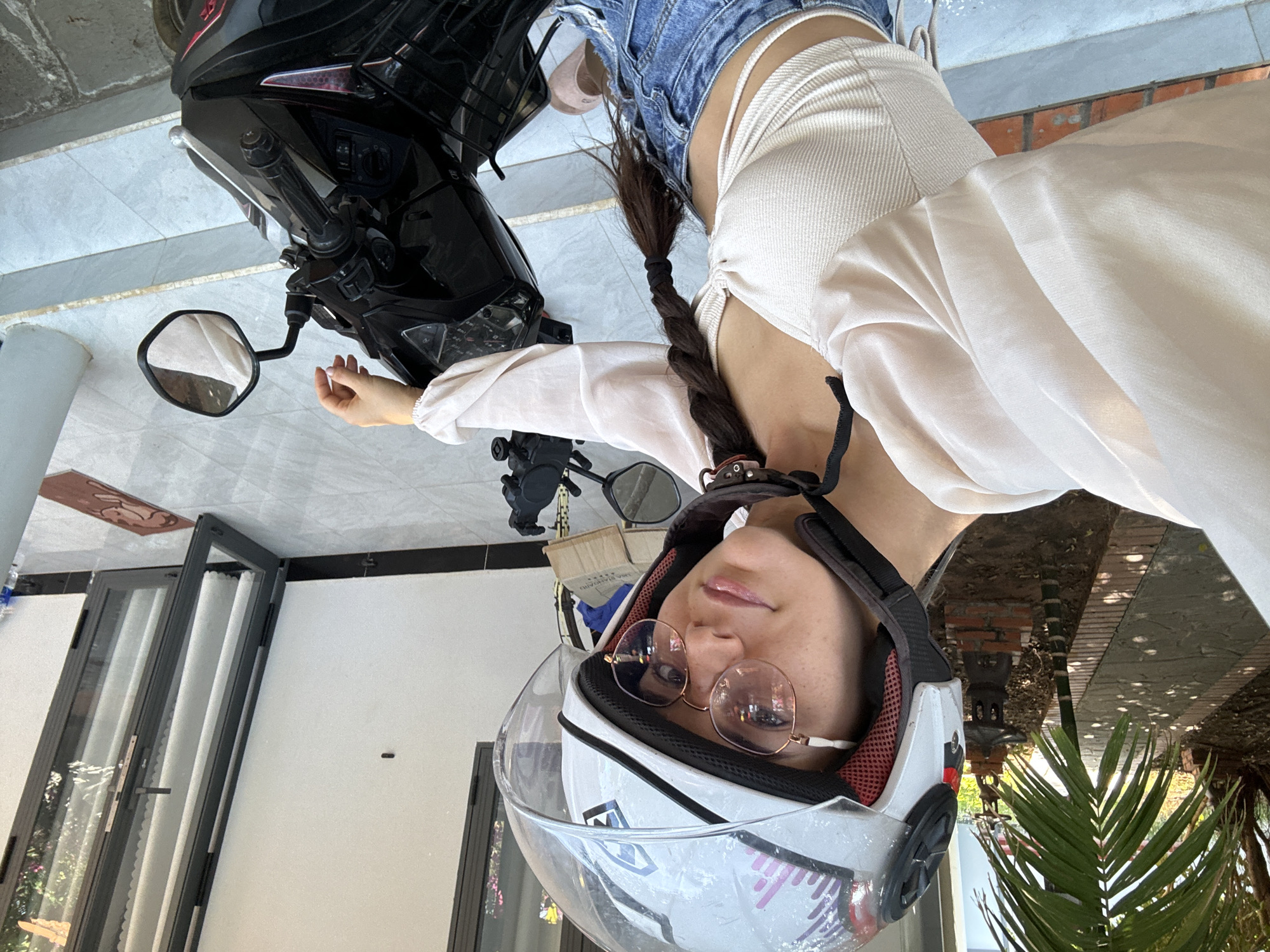 Woman in motorcycle helmet spotted indoors in Mũi Né