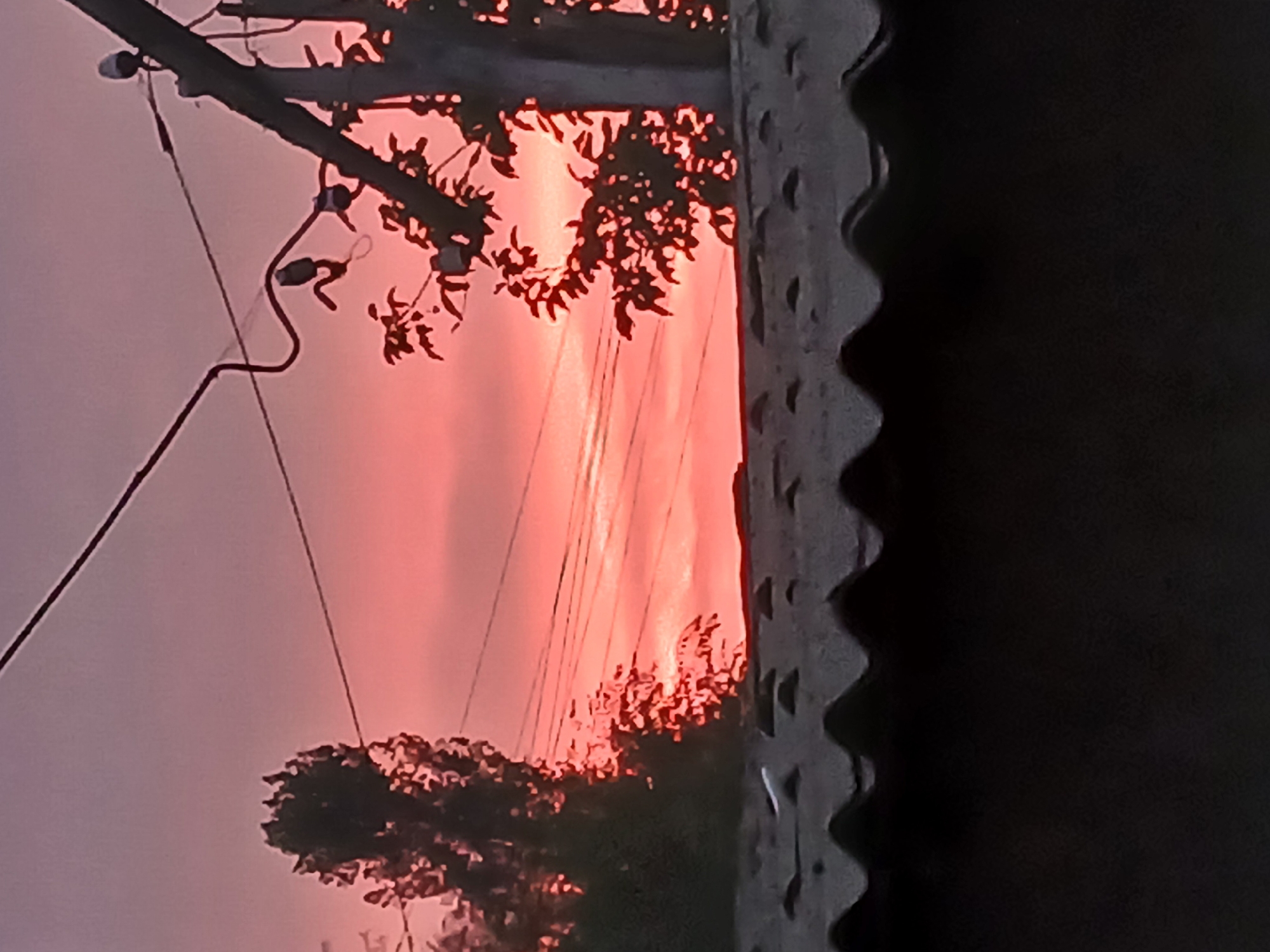 Vivid pink and orange sunset over rural Sadovoe, Kyrgyzstan