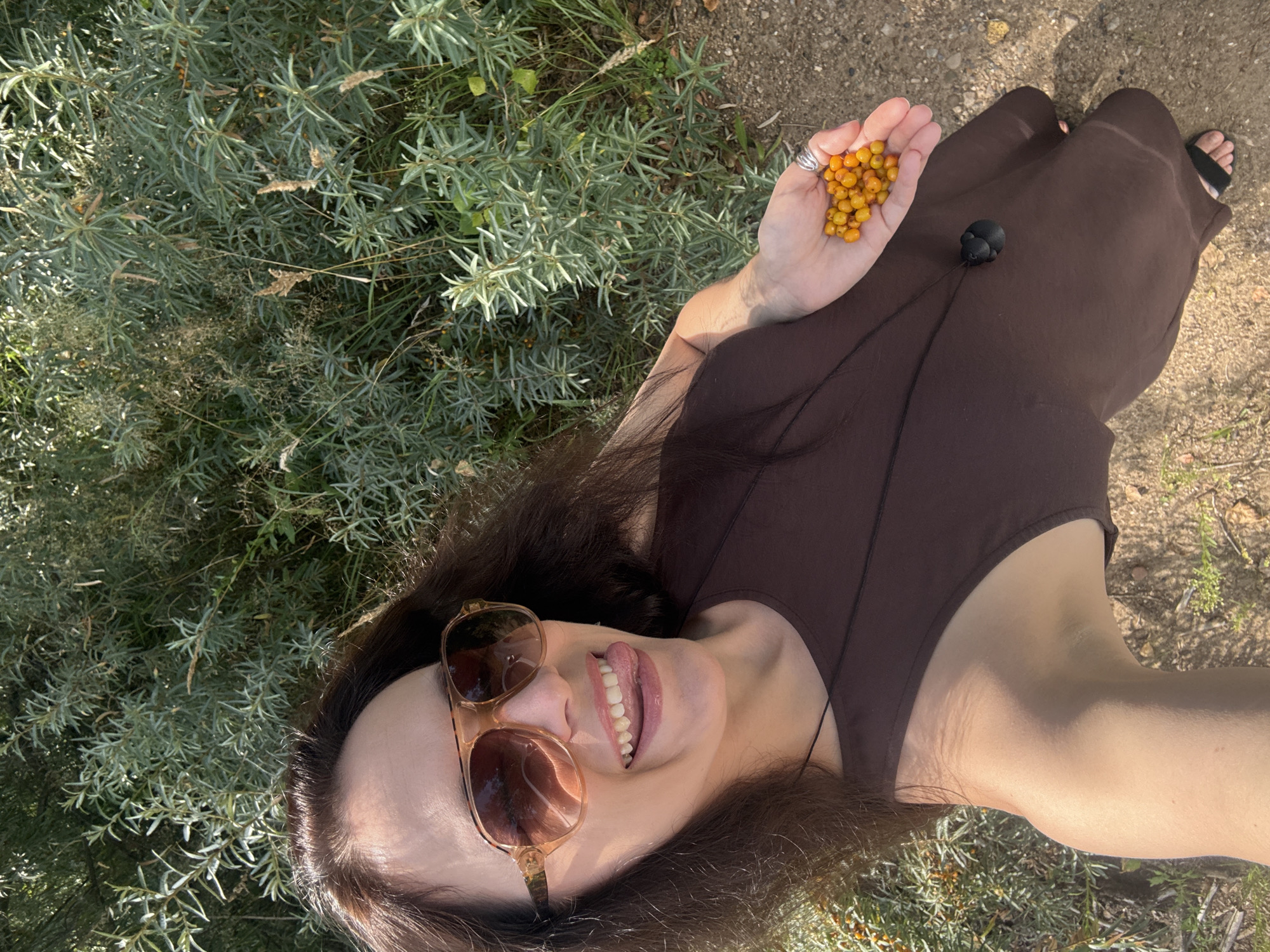 Snacking on fresh sea buckthorn berries in Chaikovsky