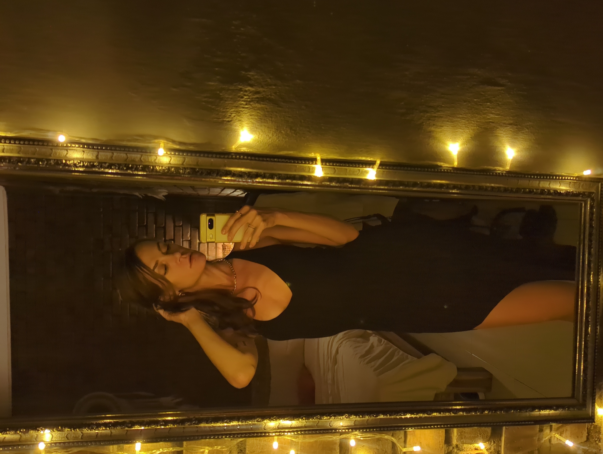 Woman takes mirror selfies in decorated North Kuta residence
