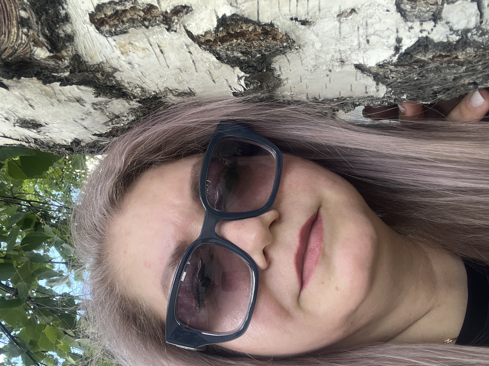 Woman with purple hair photographed by birch tree in Izhevsk
