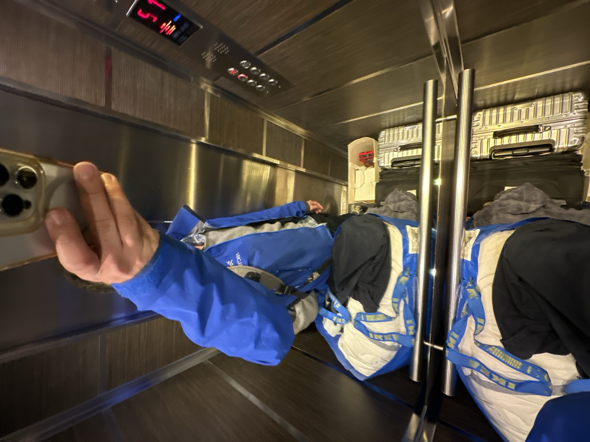 Milan residents document luggage-filled elevator and piled suitcases
