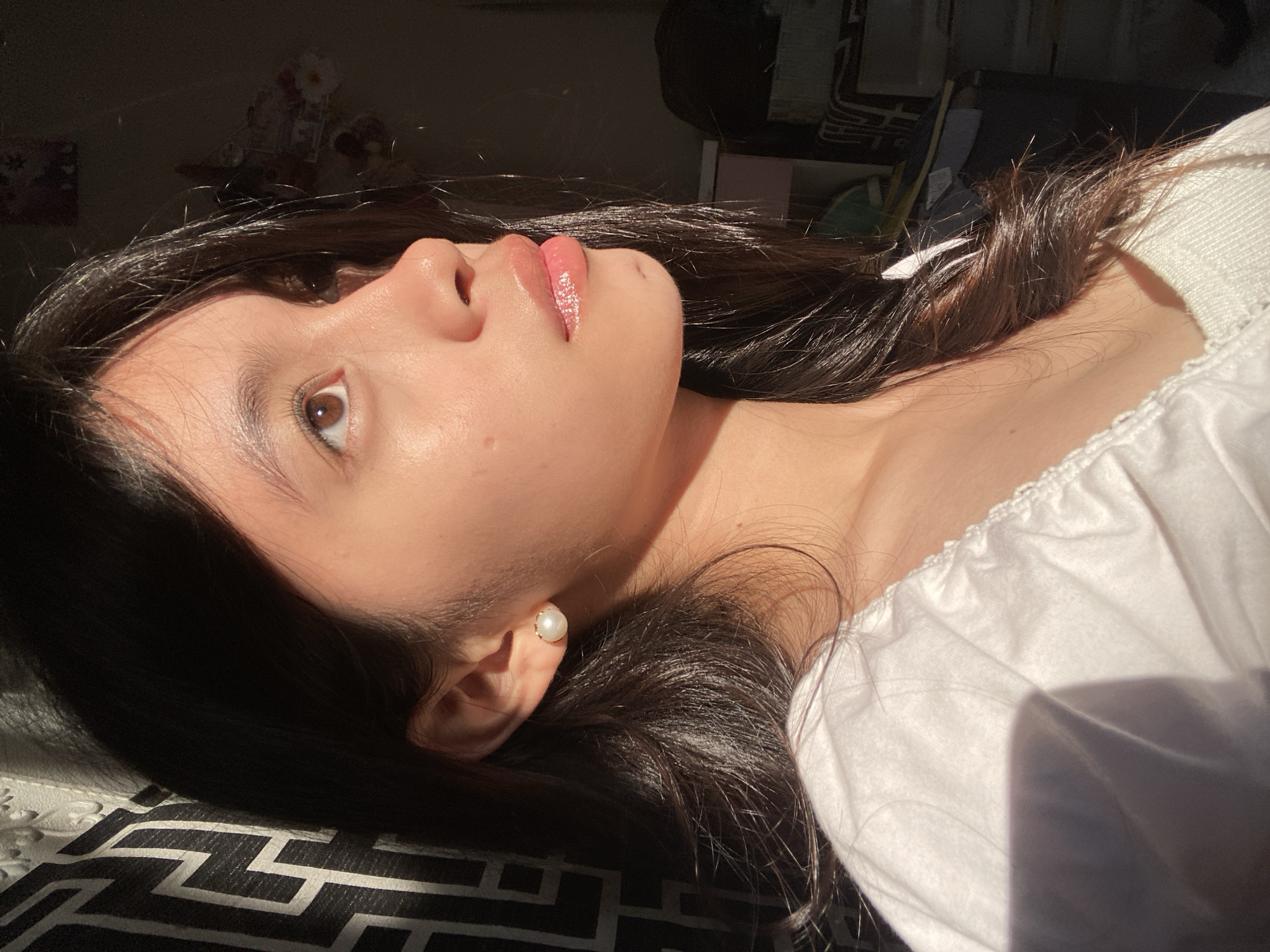 Woman documents makeup session in sunny Panabo room