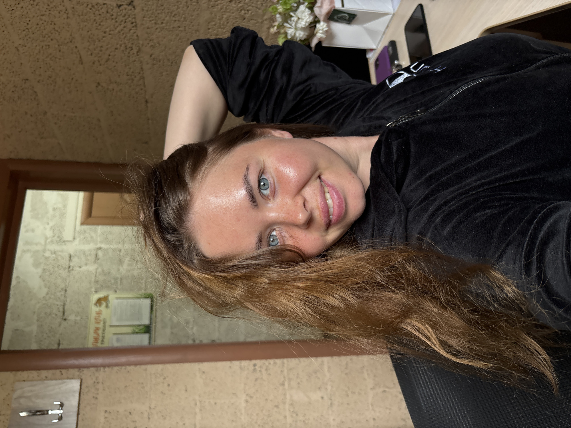 Woman takes multiple selfies in black tracksuit, Russia morning