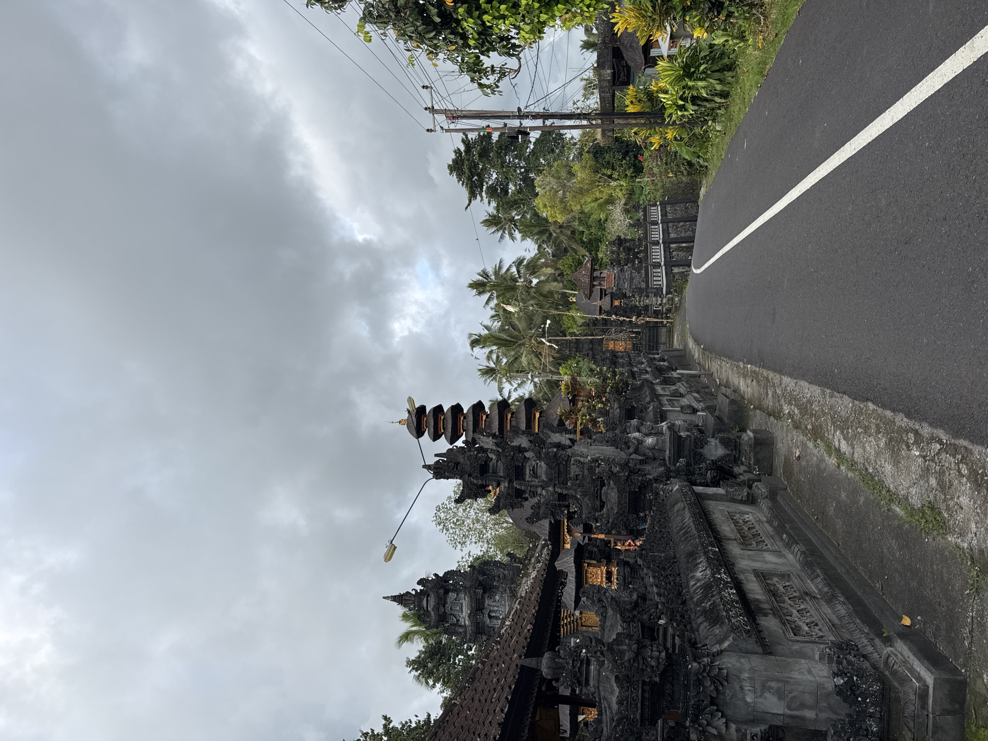 Street scene captured near temple structure in Selemadeg, Indonesia