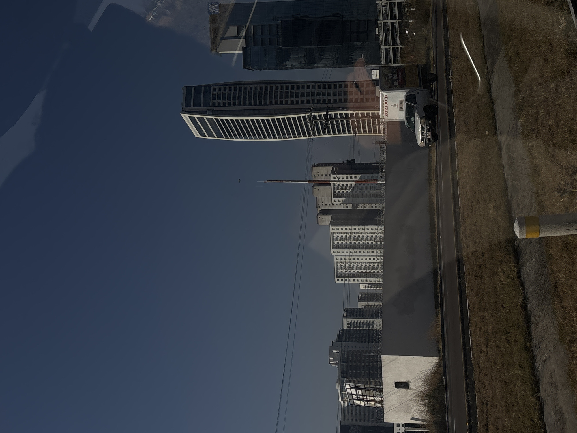 Distorted reflection of high-rise buildings captured in Mexican city