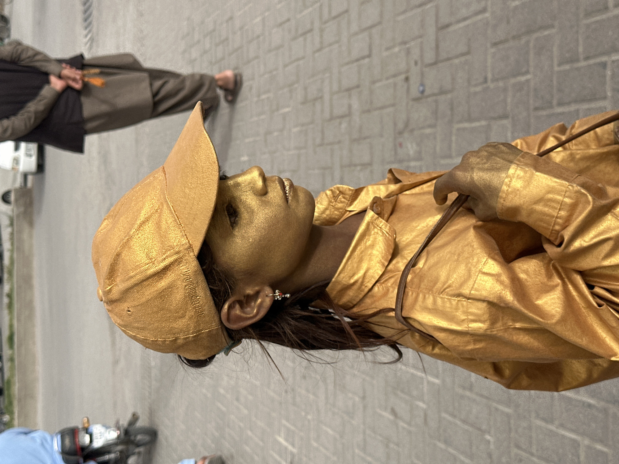 Gold-painted street performer draws audience in Quetta, Pakistan