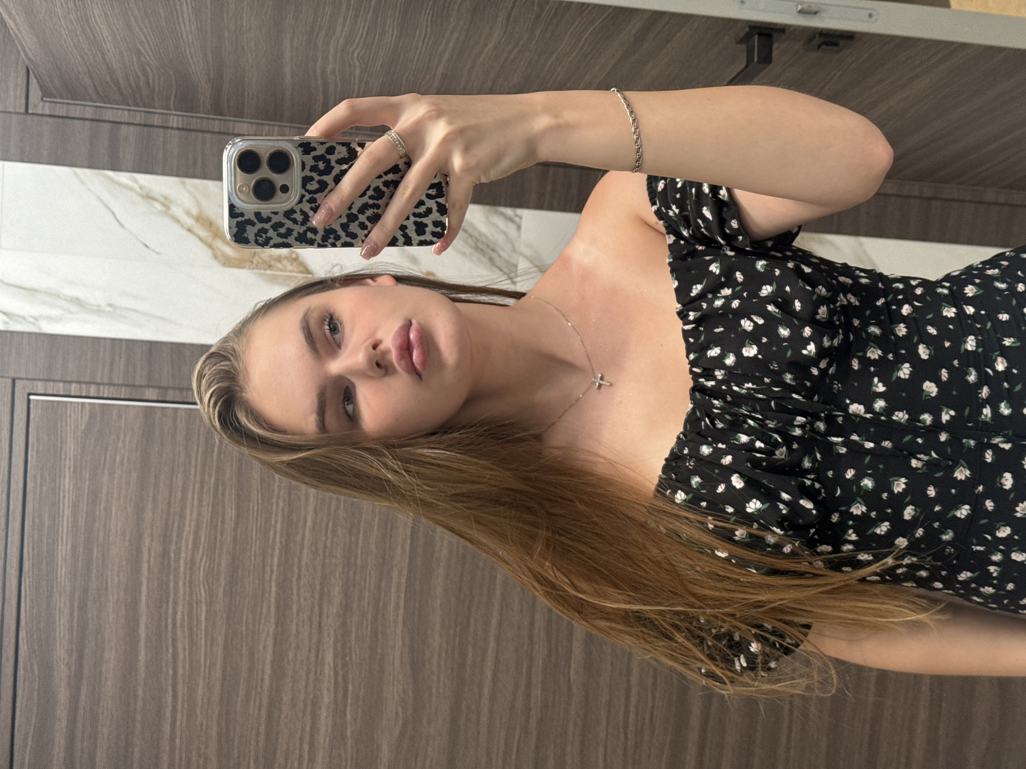 Mirror selfie series in a Dnipro bathroom, floral black dress