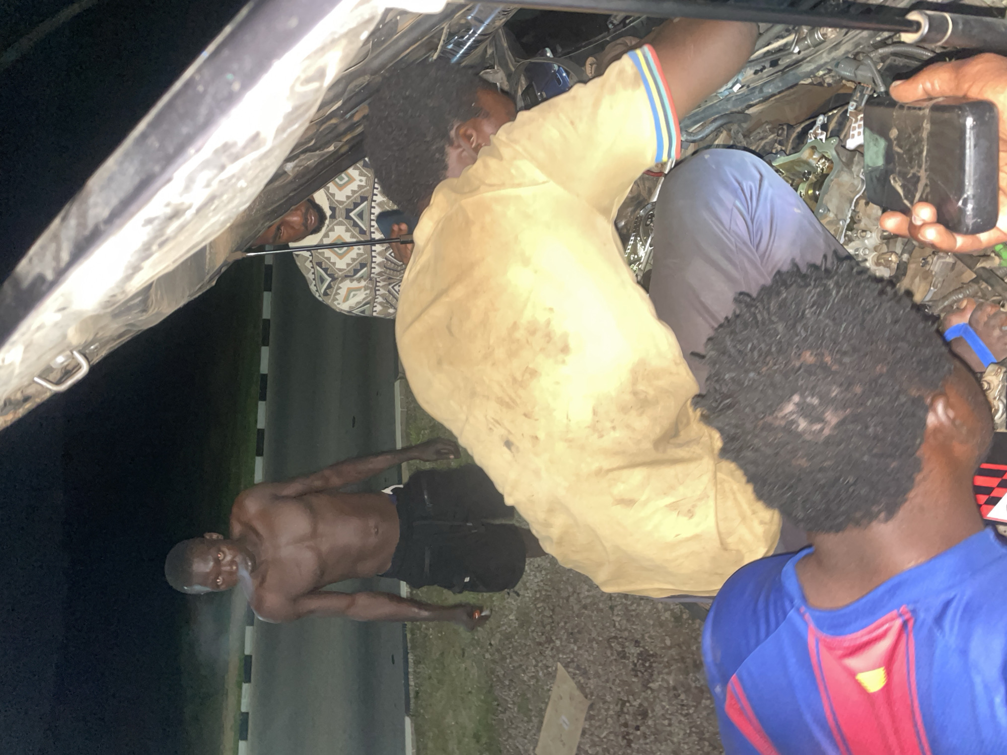 Roadside breakdown and evening highway scenes near Kuje, Nigeria