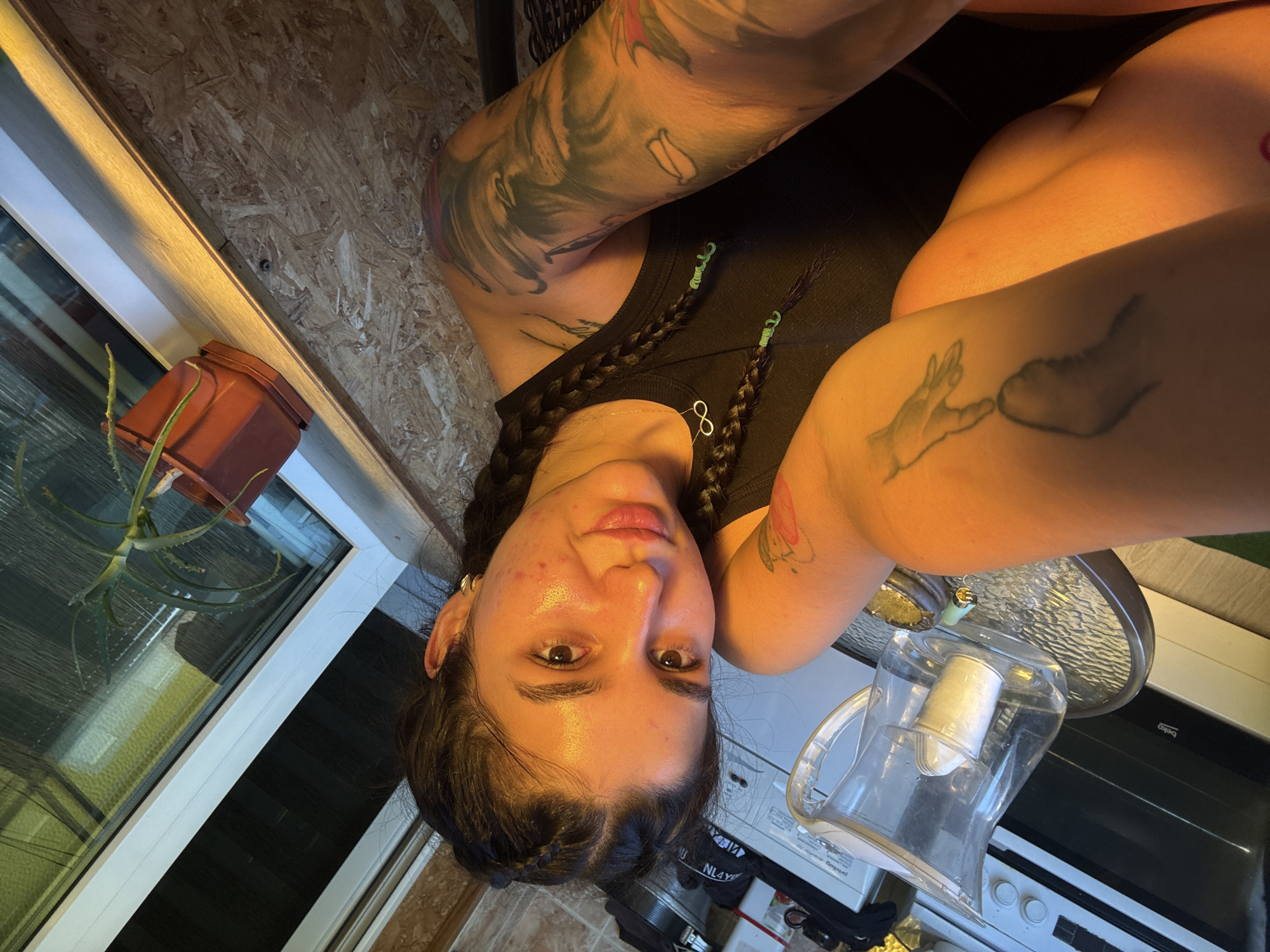 Tattooed woman takes selfies in Veliko Tarnovo, Bulgaria