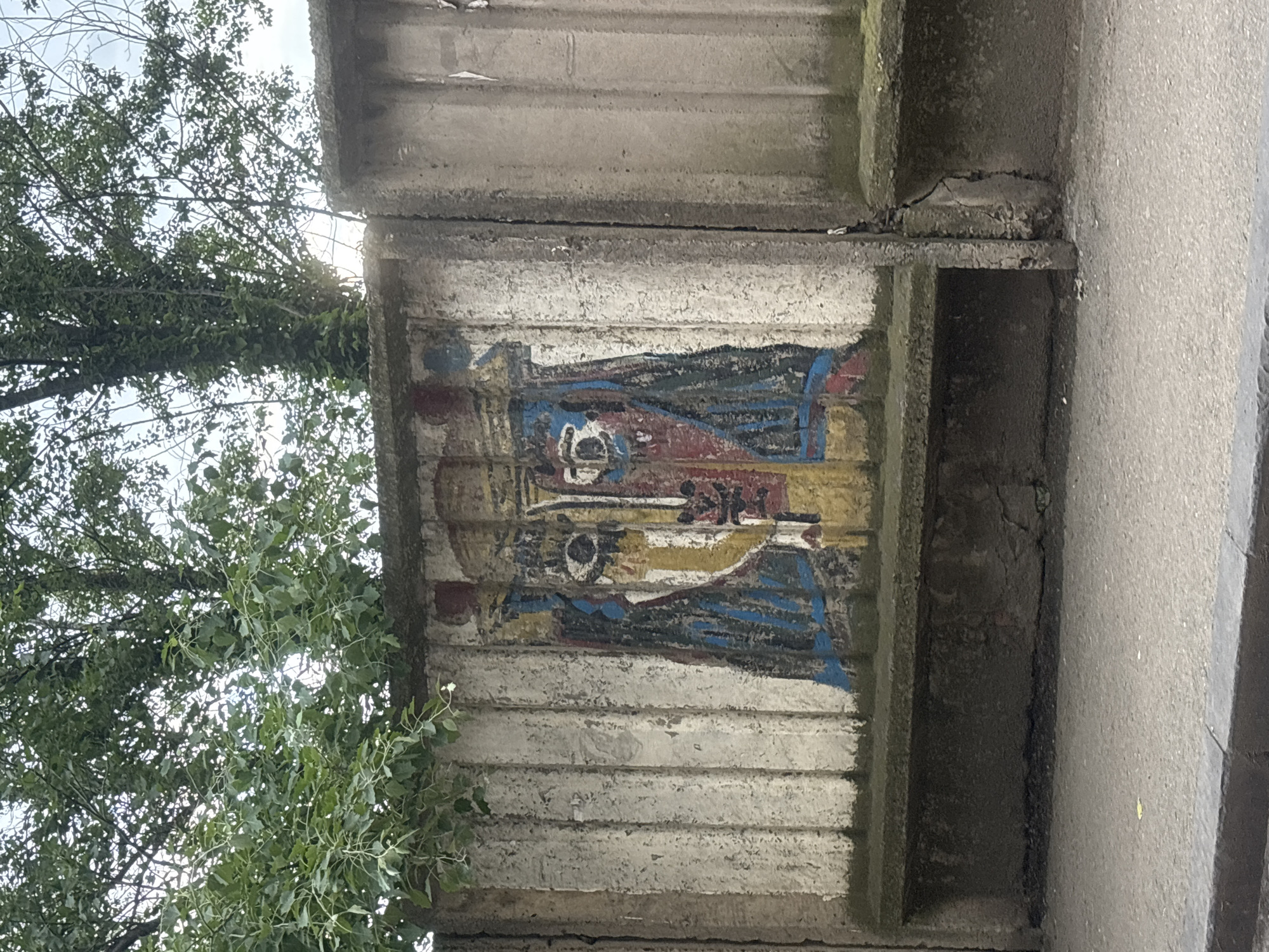 Street scenes captured in Tbilisi featuring murals and taxi