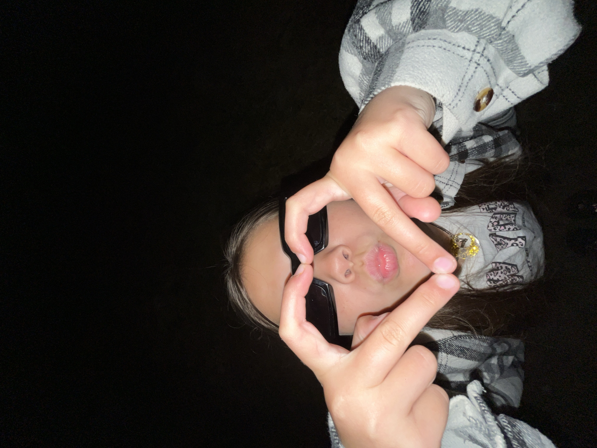 Young people pose with sunglasses in nighttime Russia photo session