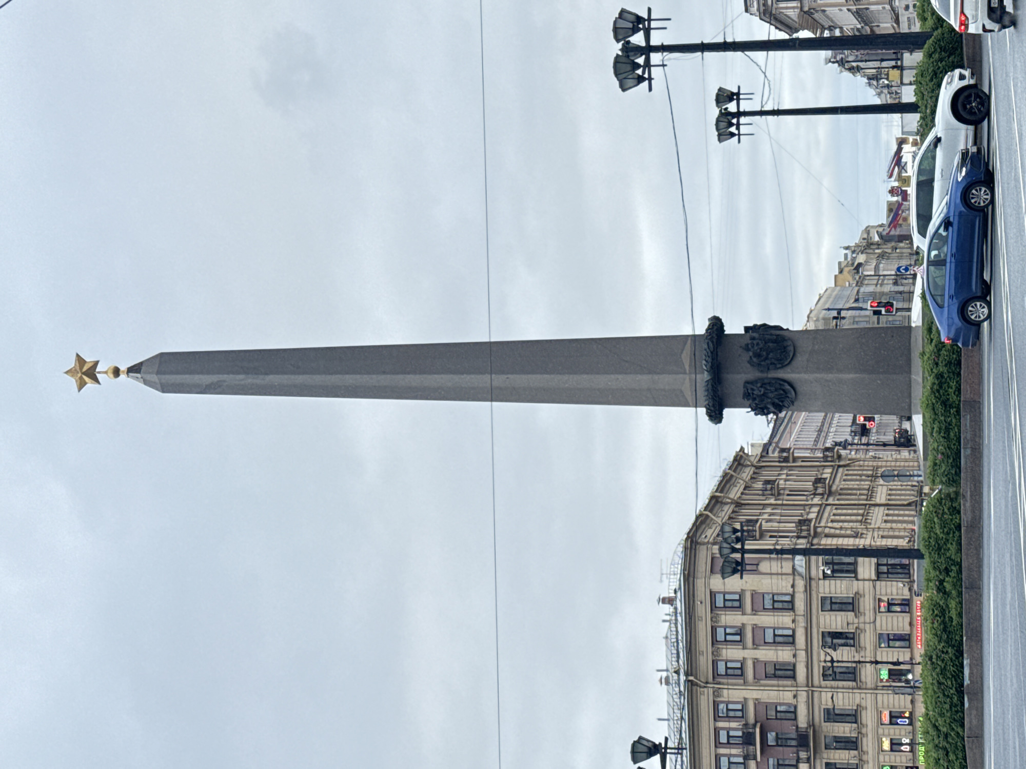 Tourist captures Palace Square monuments and LED advertising truck