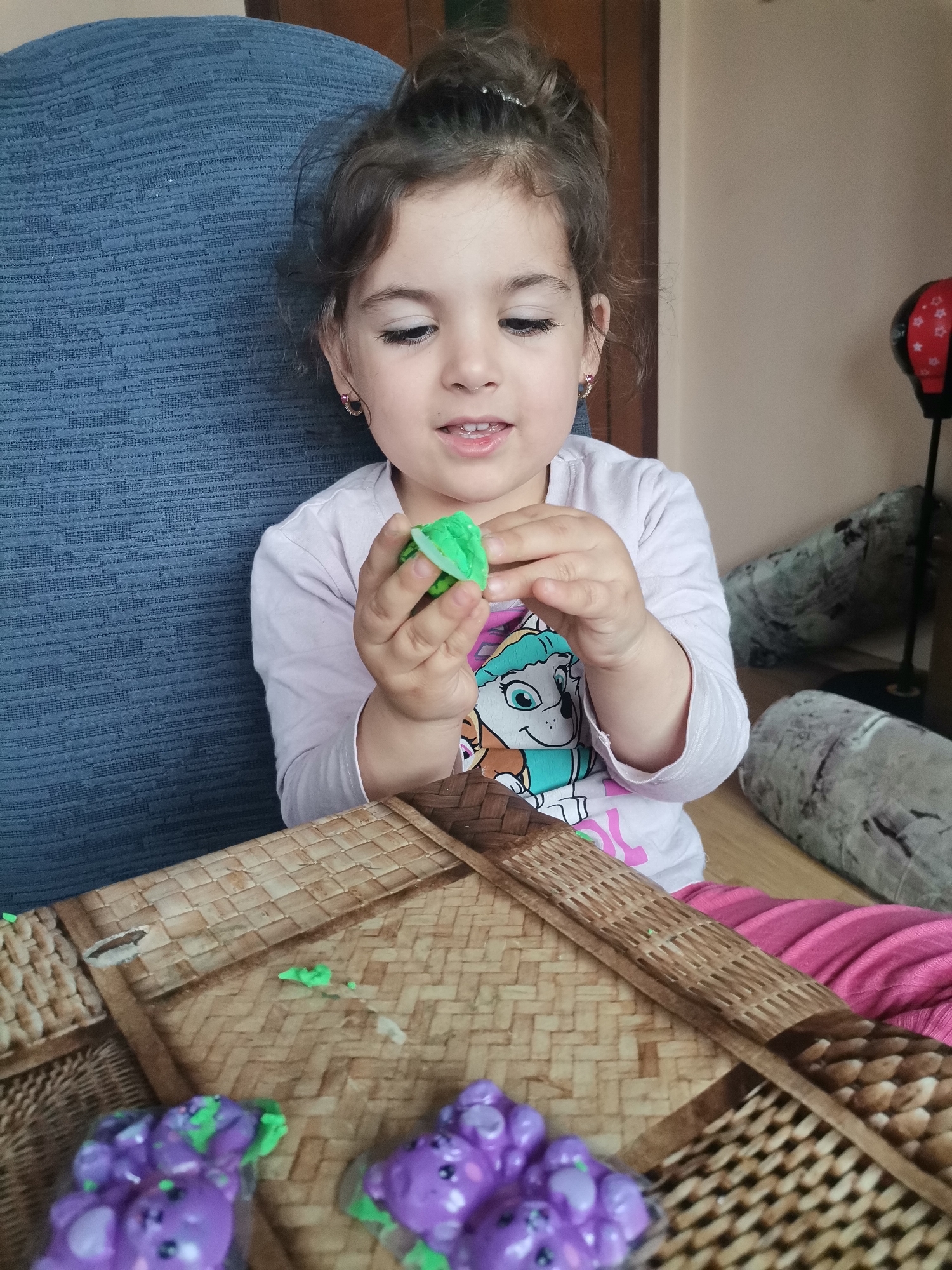 Children craft with clay and playdough at tables