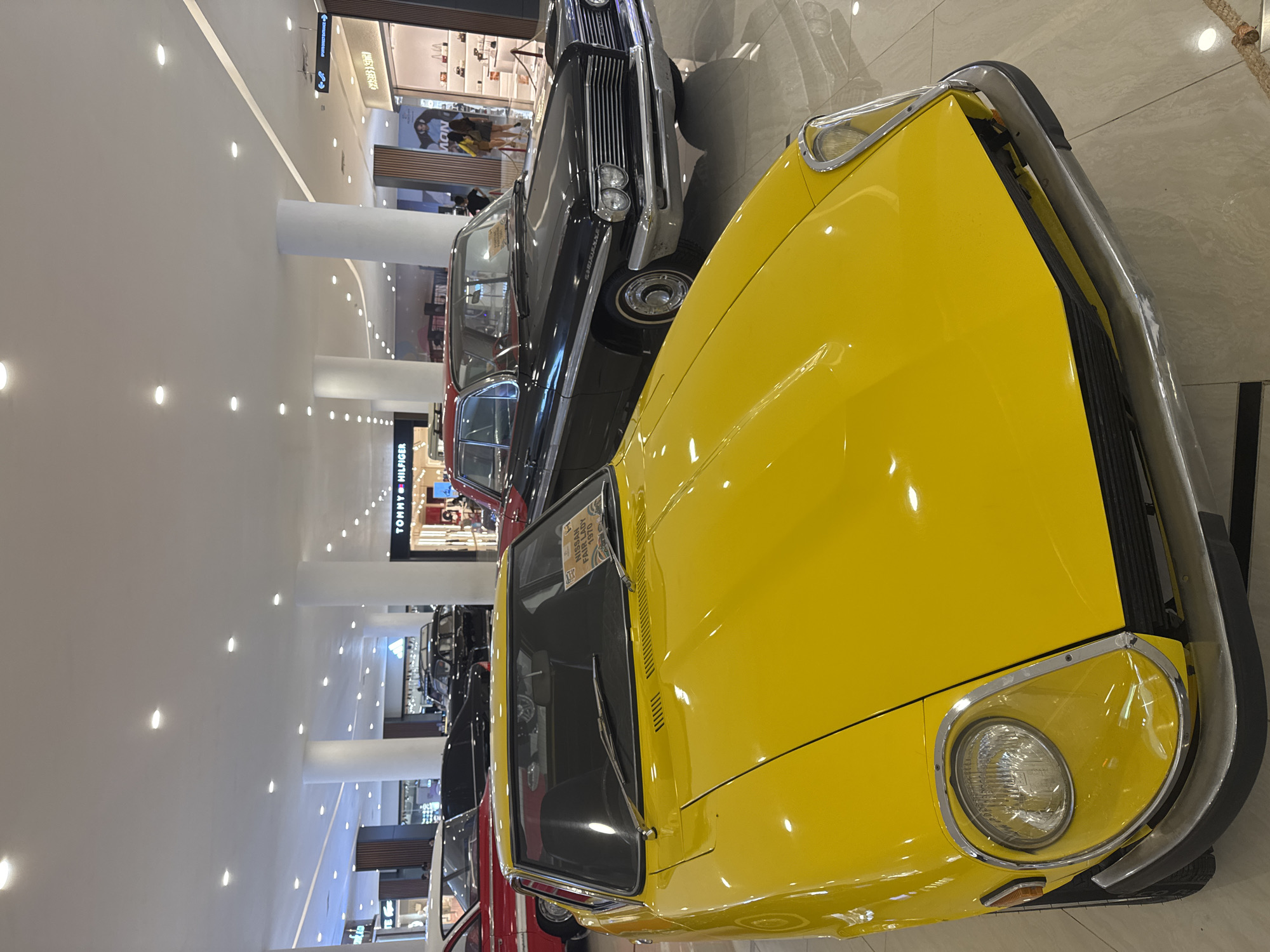 Vintage car display showcased in mall during early morning hours