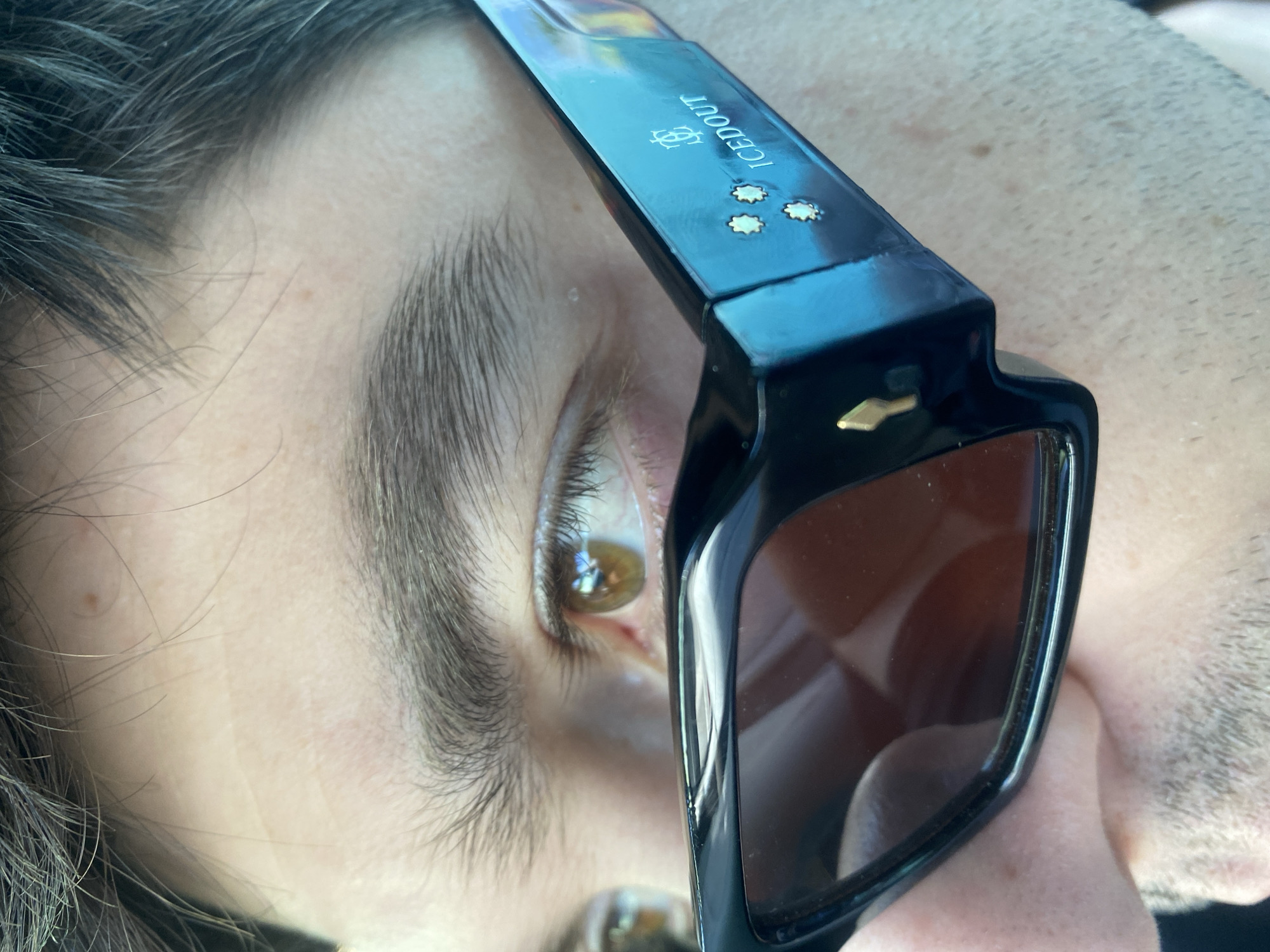 Person in branded sunglasses photographed in Varna, Bulgaria