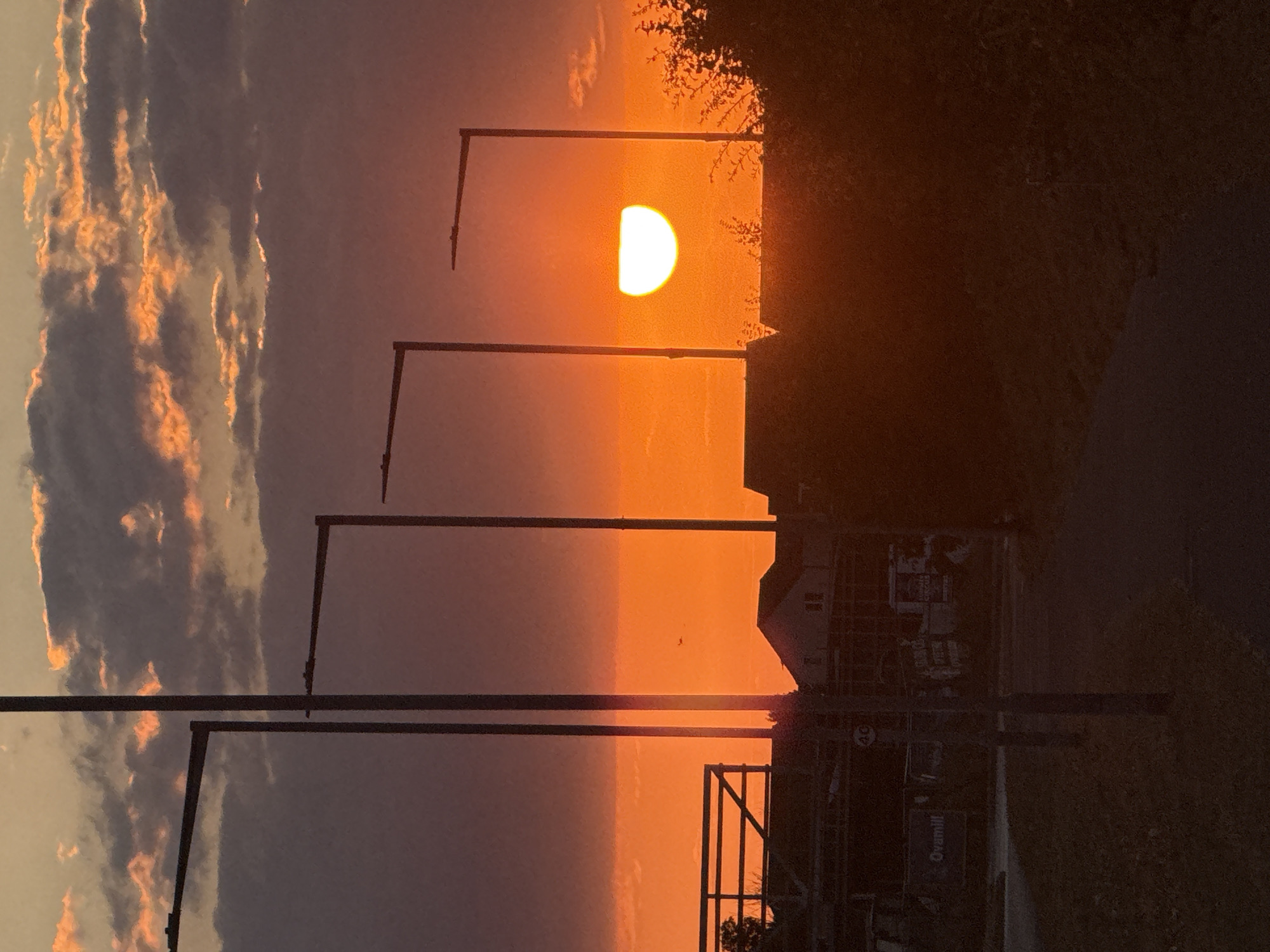 Sunset silhouette over Great Yarmouth rooftops and clouds