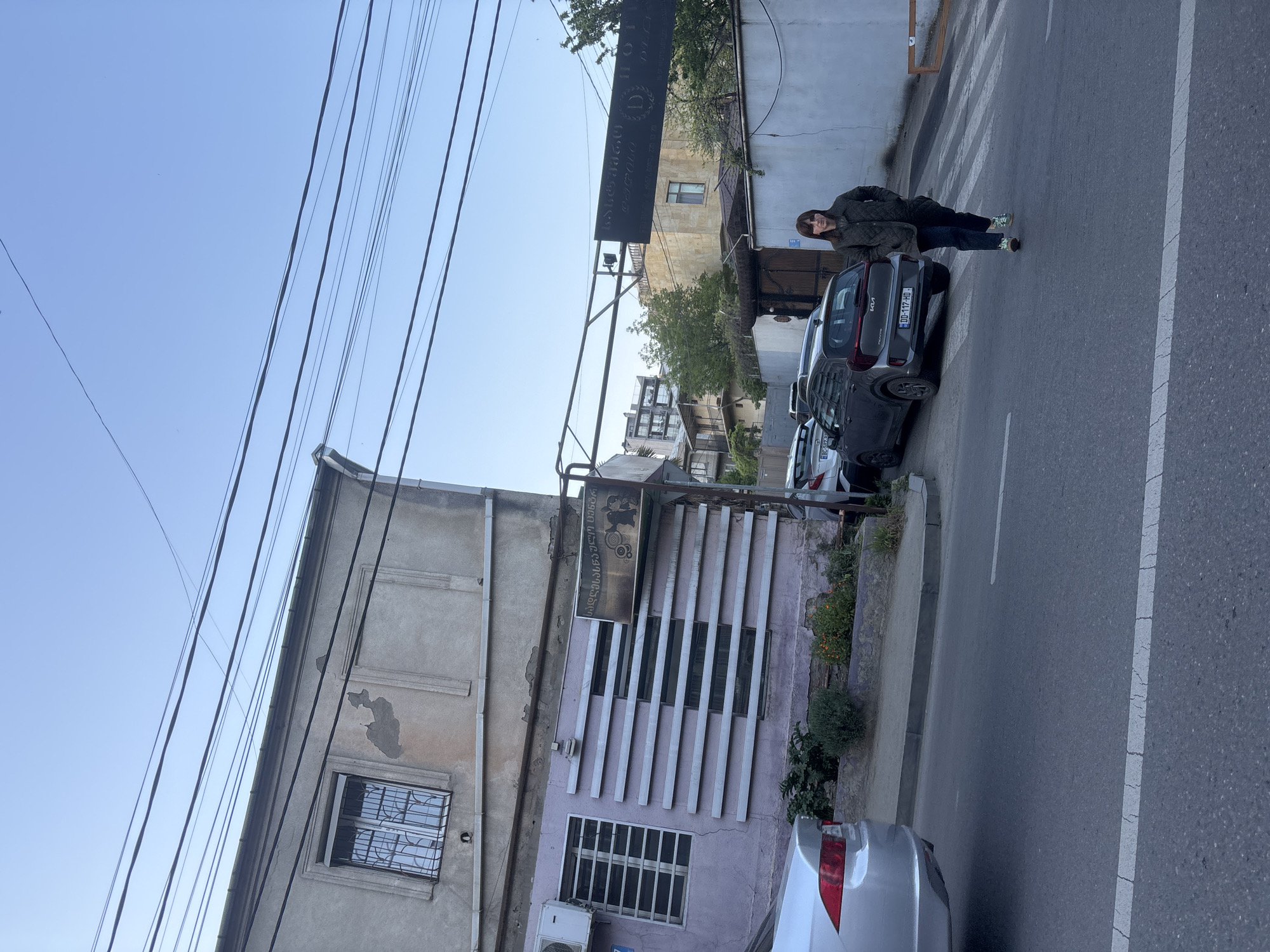 Casual street scenes documented across Tbilisi during afternoon hours