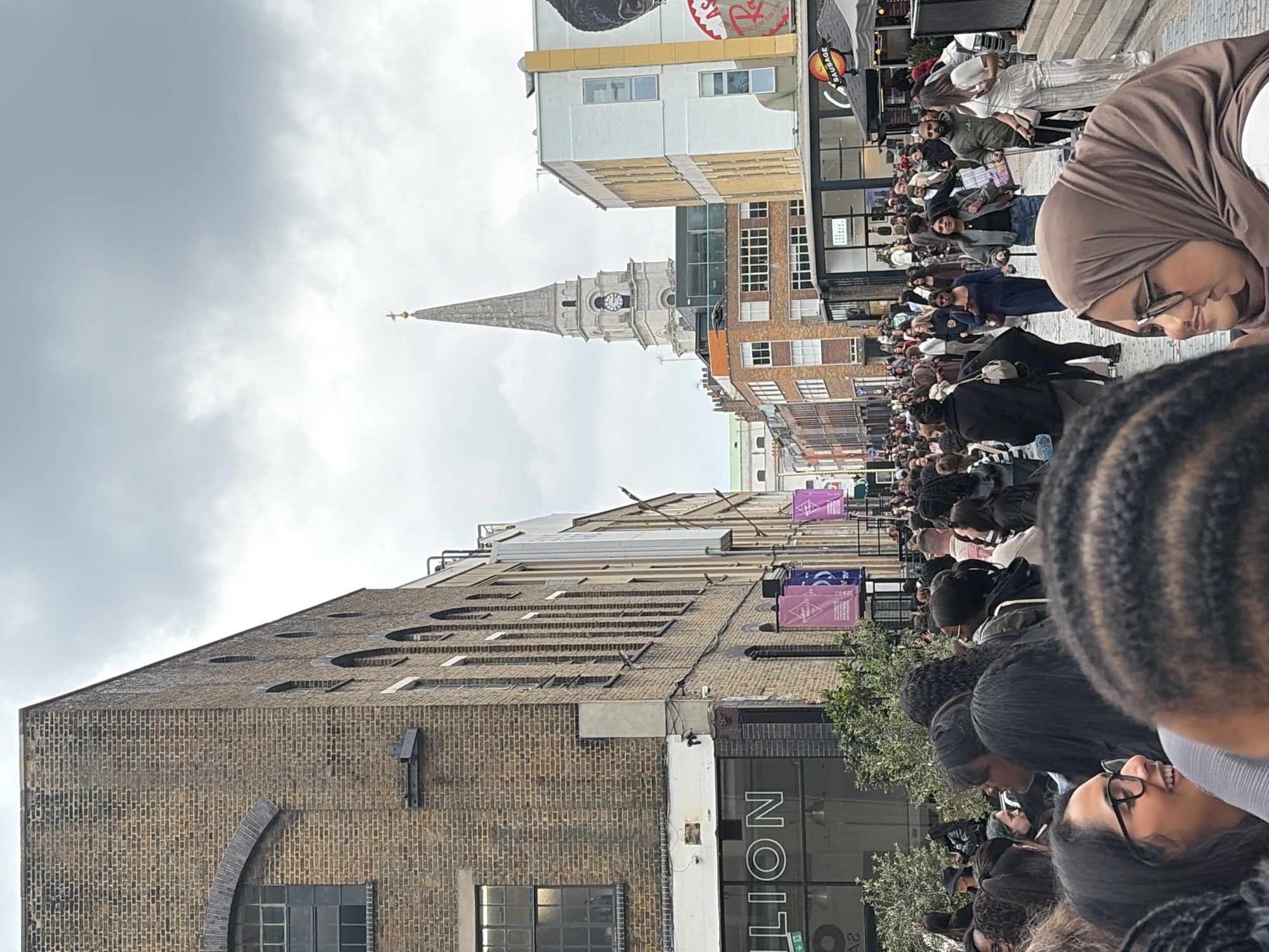 Diverse crowd gathers on London's Brick Lane
