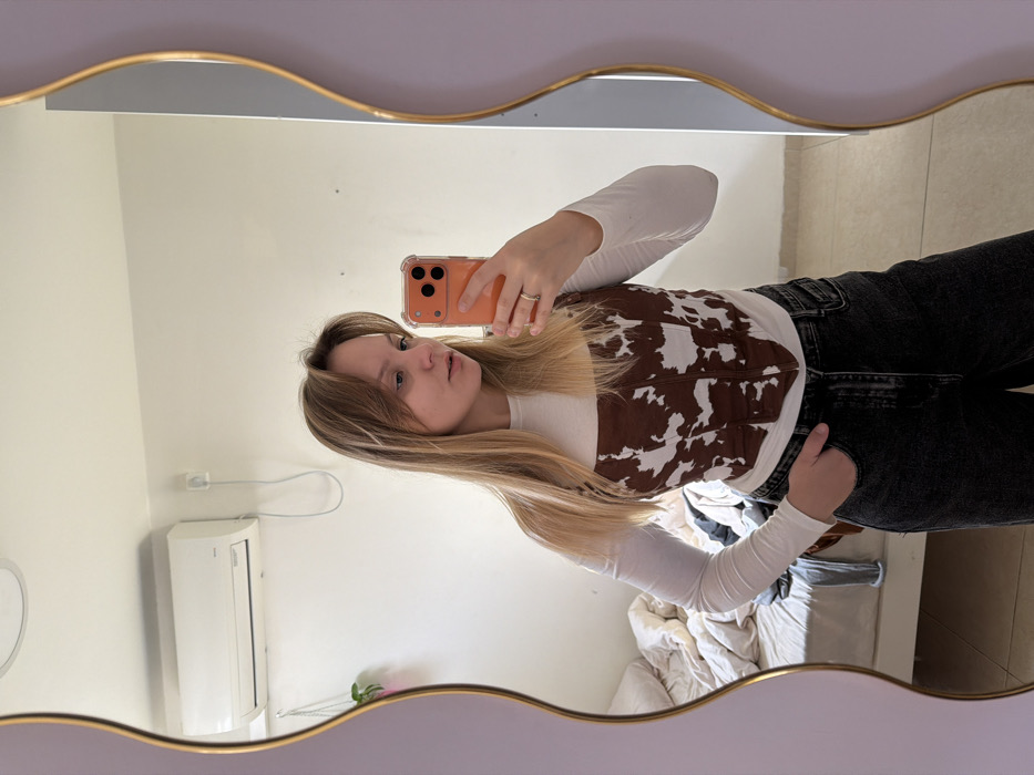 Woman takes mirror selfies in Tel Aviv bedroom