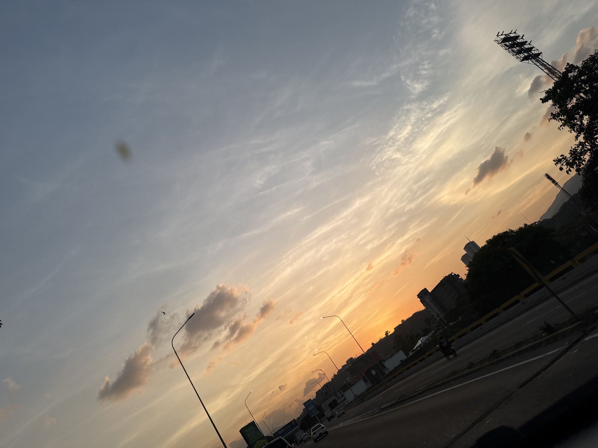 Sunset observed over Caracas highway showing colorful sky gradient