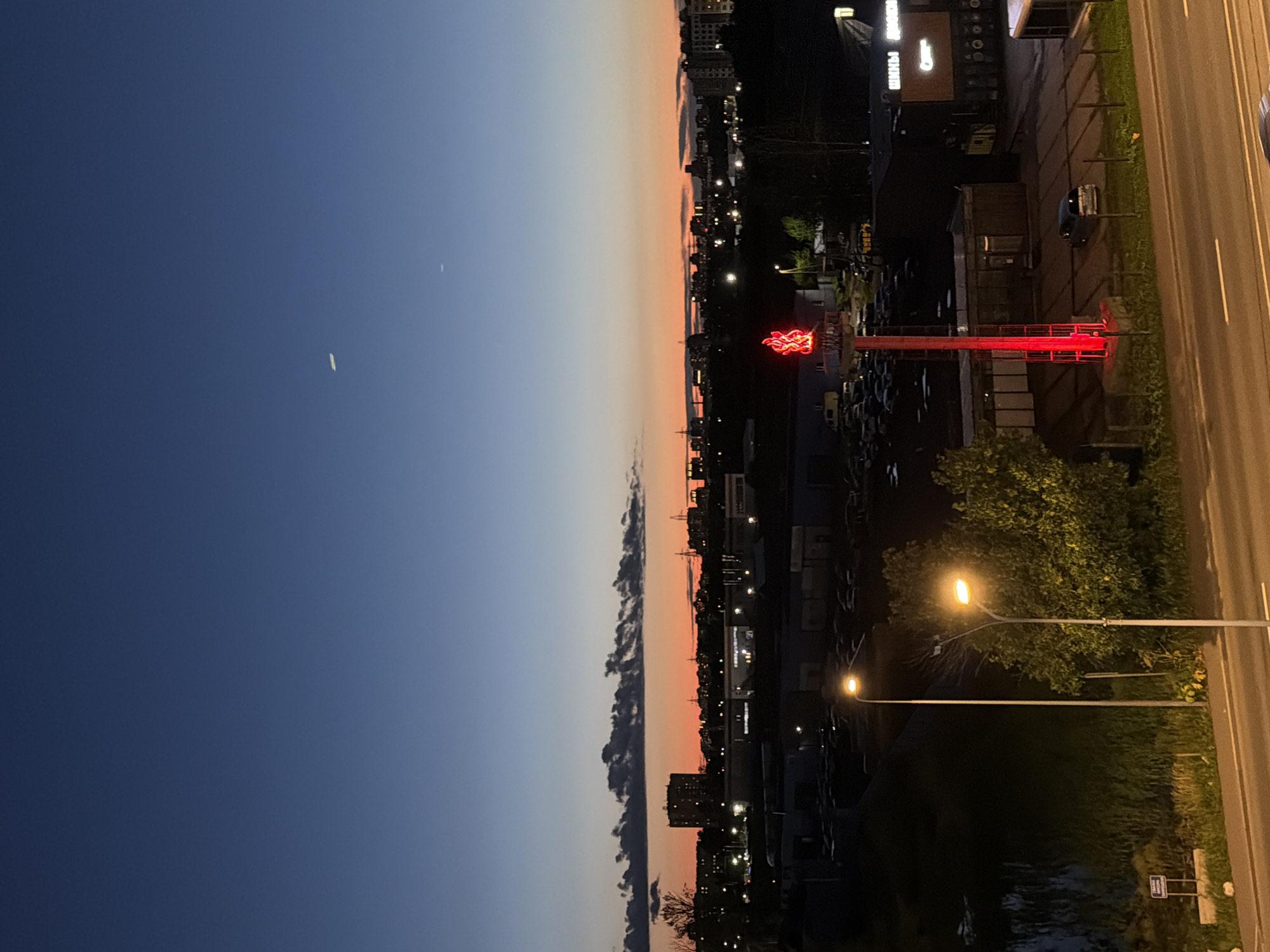 City skyline at dusk, blue hour fading into sunset