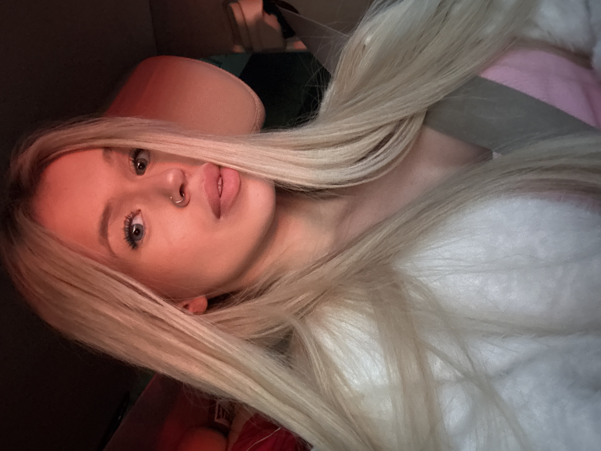 Warm-lit evening selfie inside a car, Saint Petersburg