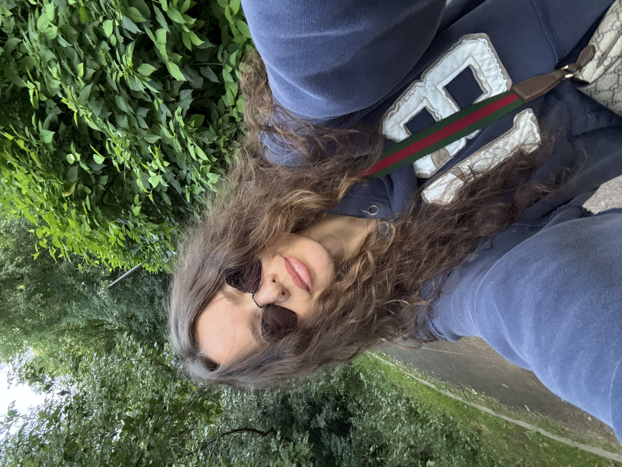 Selfie moment on a sunny park path in Moscow