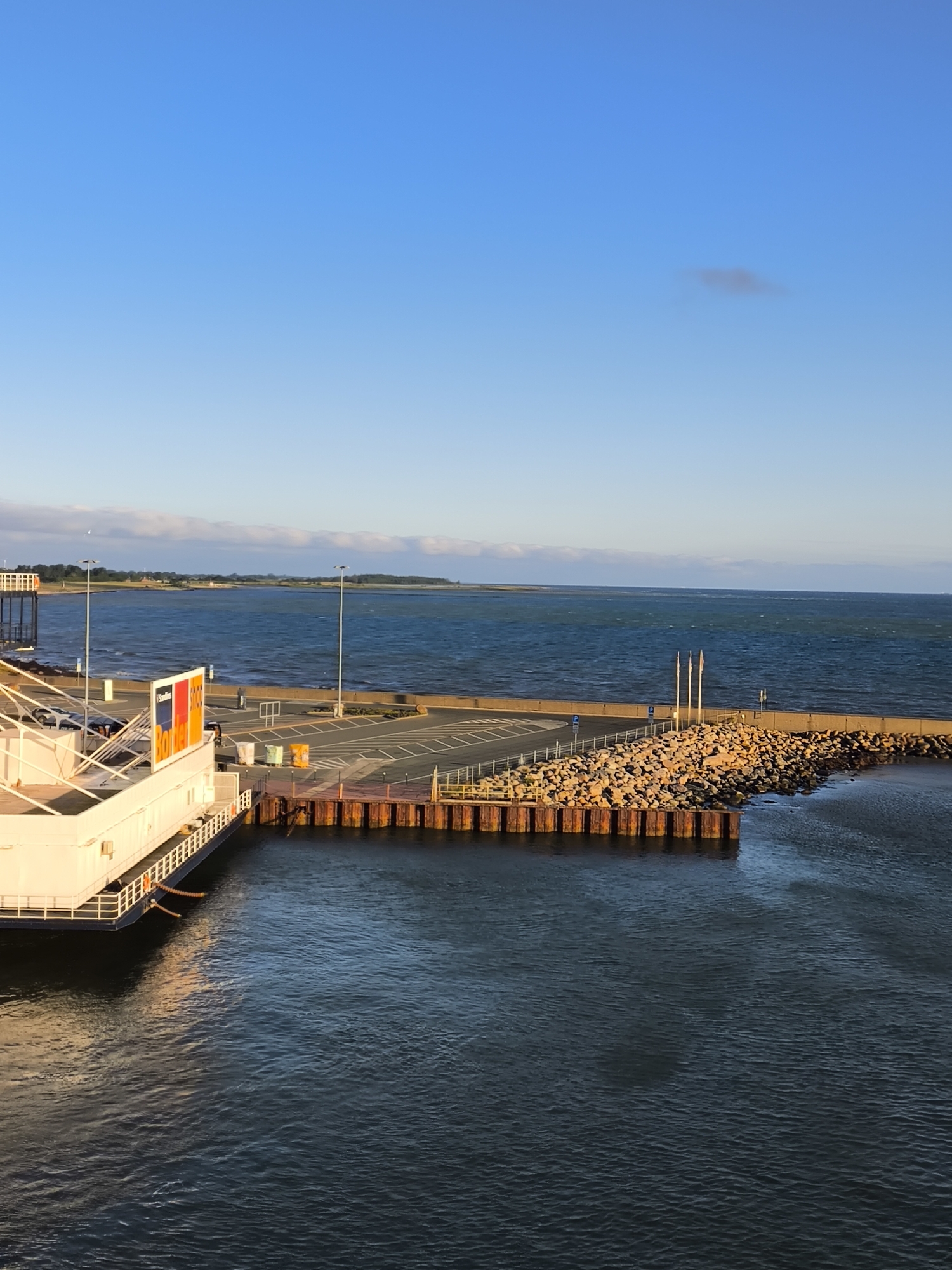 Ferry approaches Fehmarn terminal on a calm, clear morning
