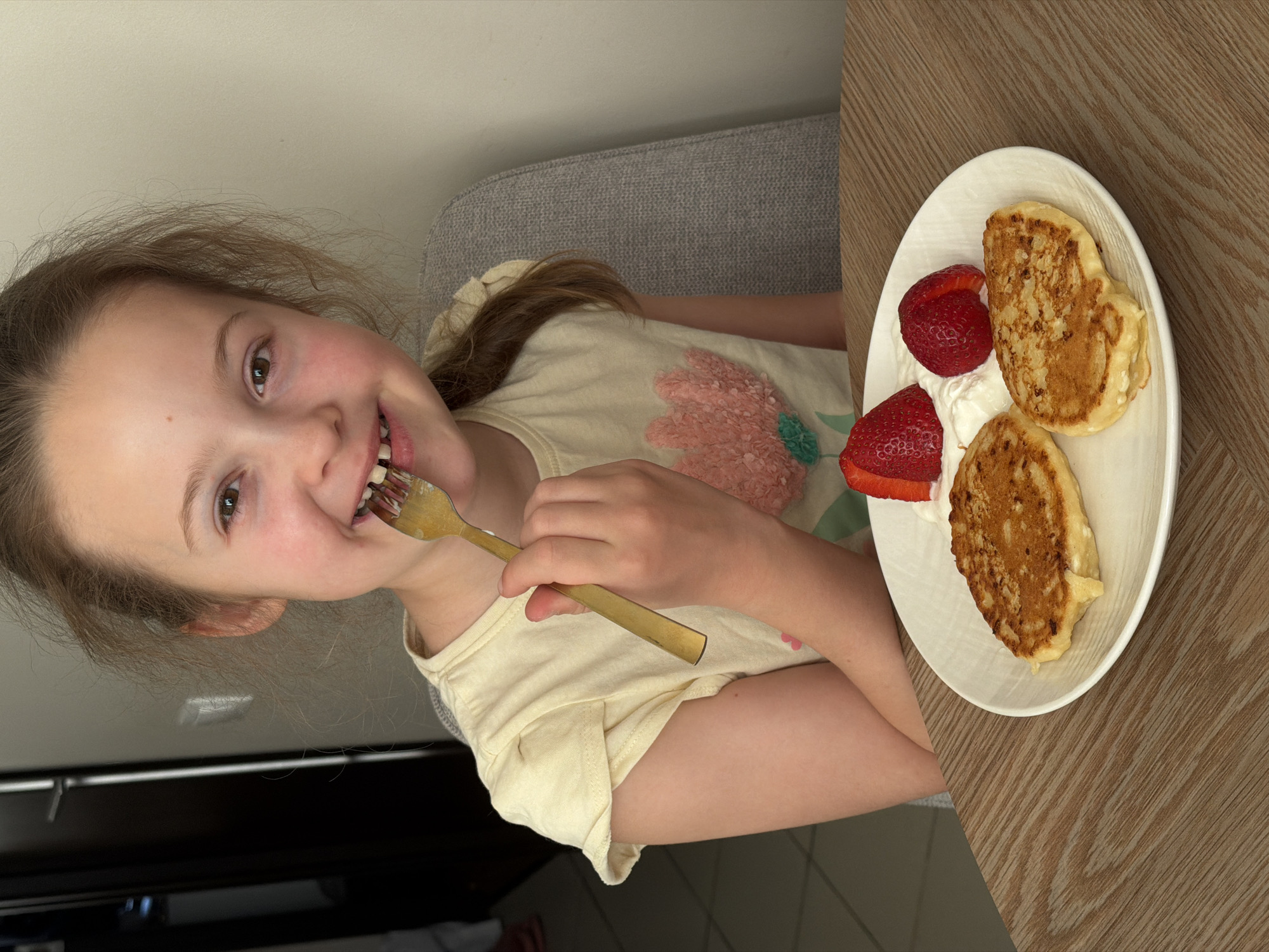 Young girl enjoys pancake meal in Riga