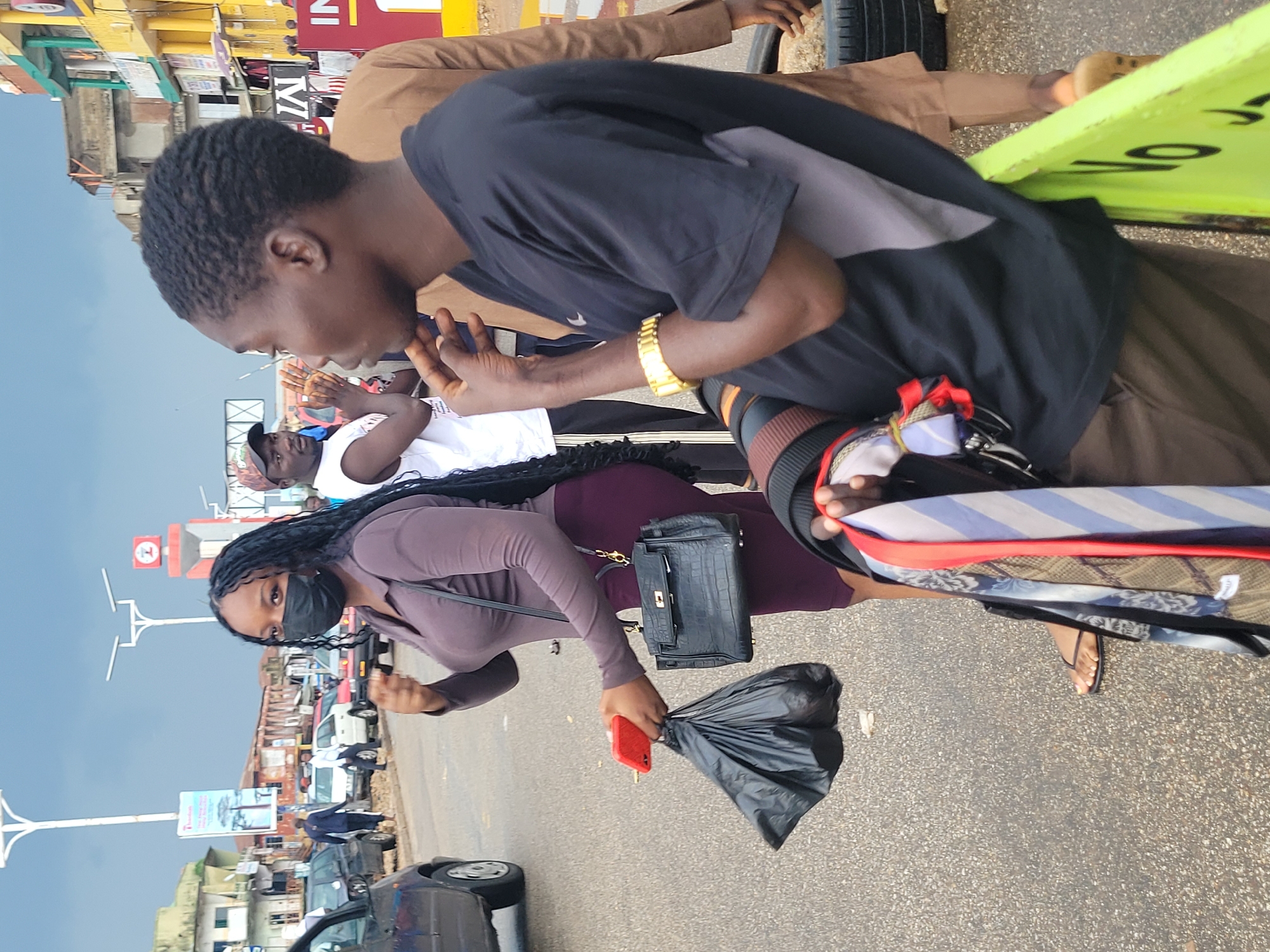 Rainy afternoon street activity near Jos city center, Nigeria