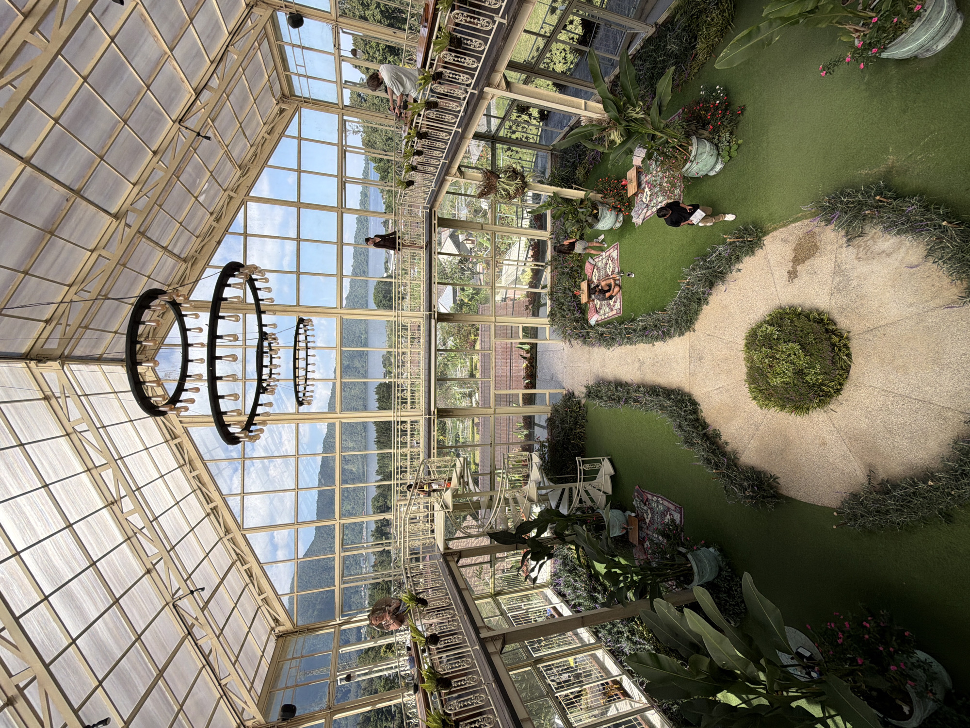 Picnic inside a glass greenhouse with mountain views, Baturiti