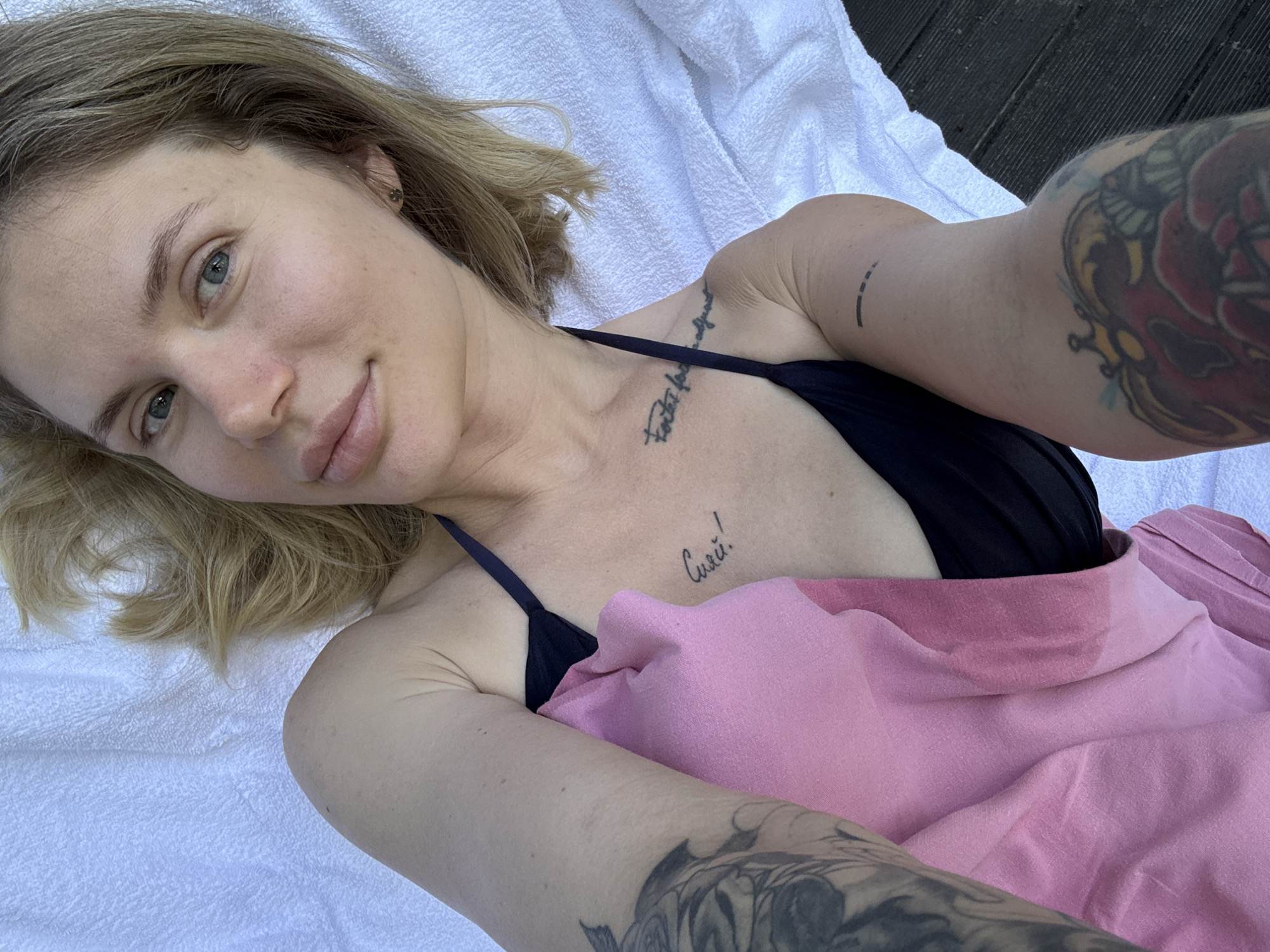 Woman enjoys poolside leisure time in rural Russia