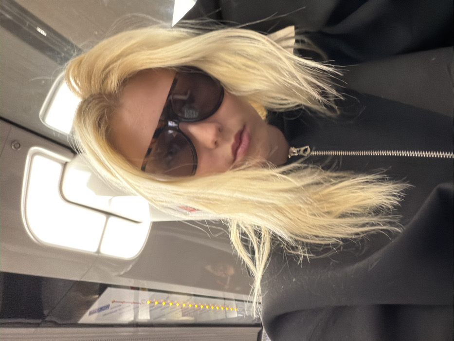 Woman takes selfie on Paris Metro train