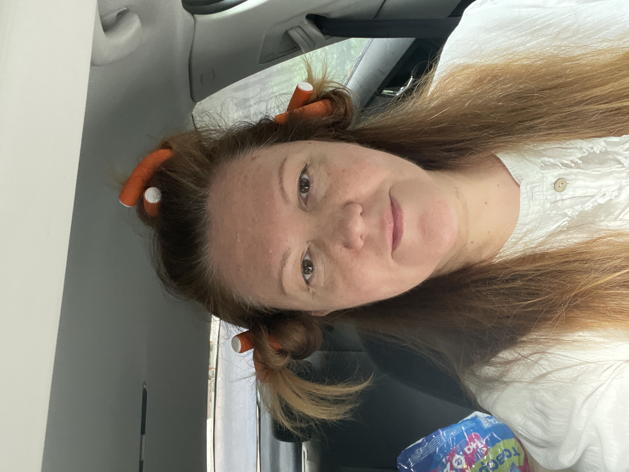 Hair rollers in, behind the wheel, somewhere in Moscow