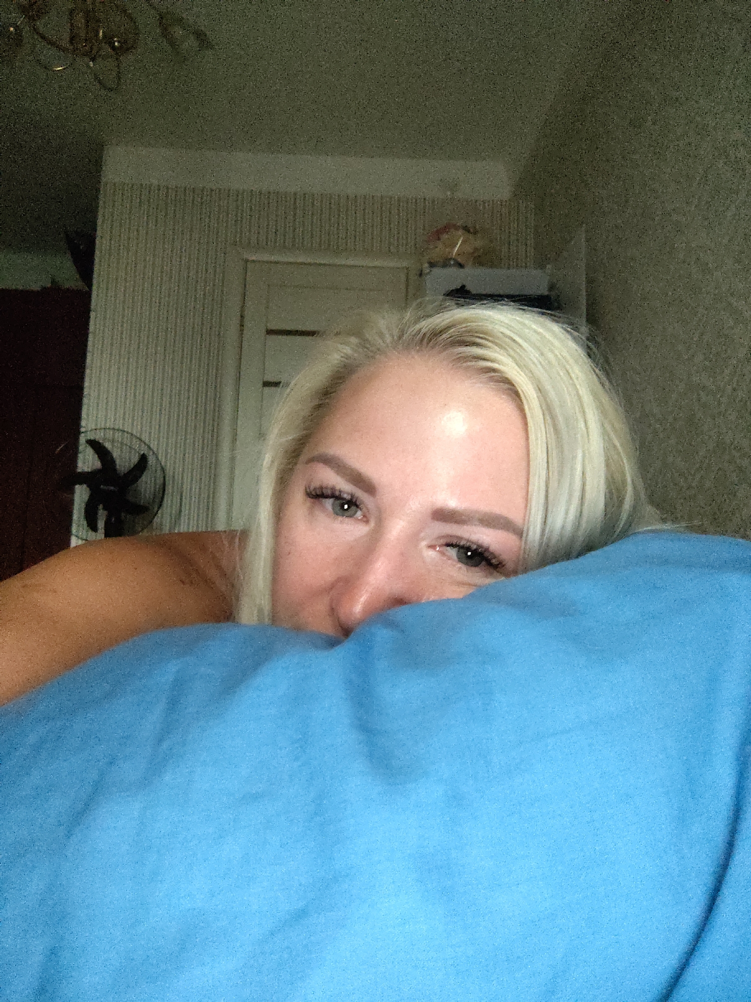 Relaxed bedroom moment in Kyiv, shot from close range