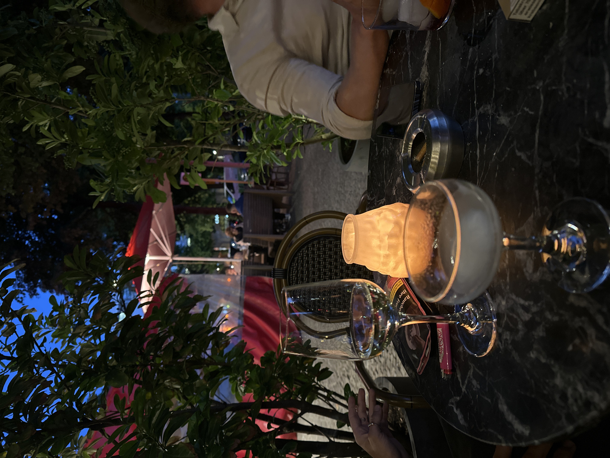 Evening dining scene captured at Berlin outdoor terrace