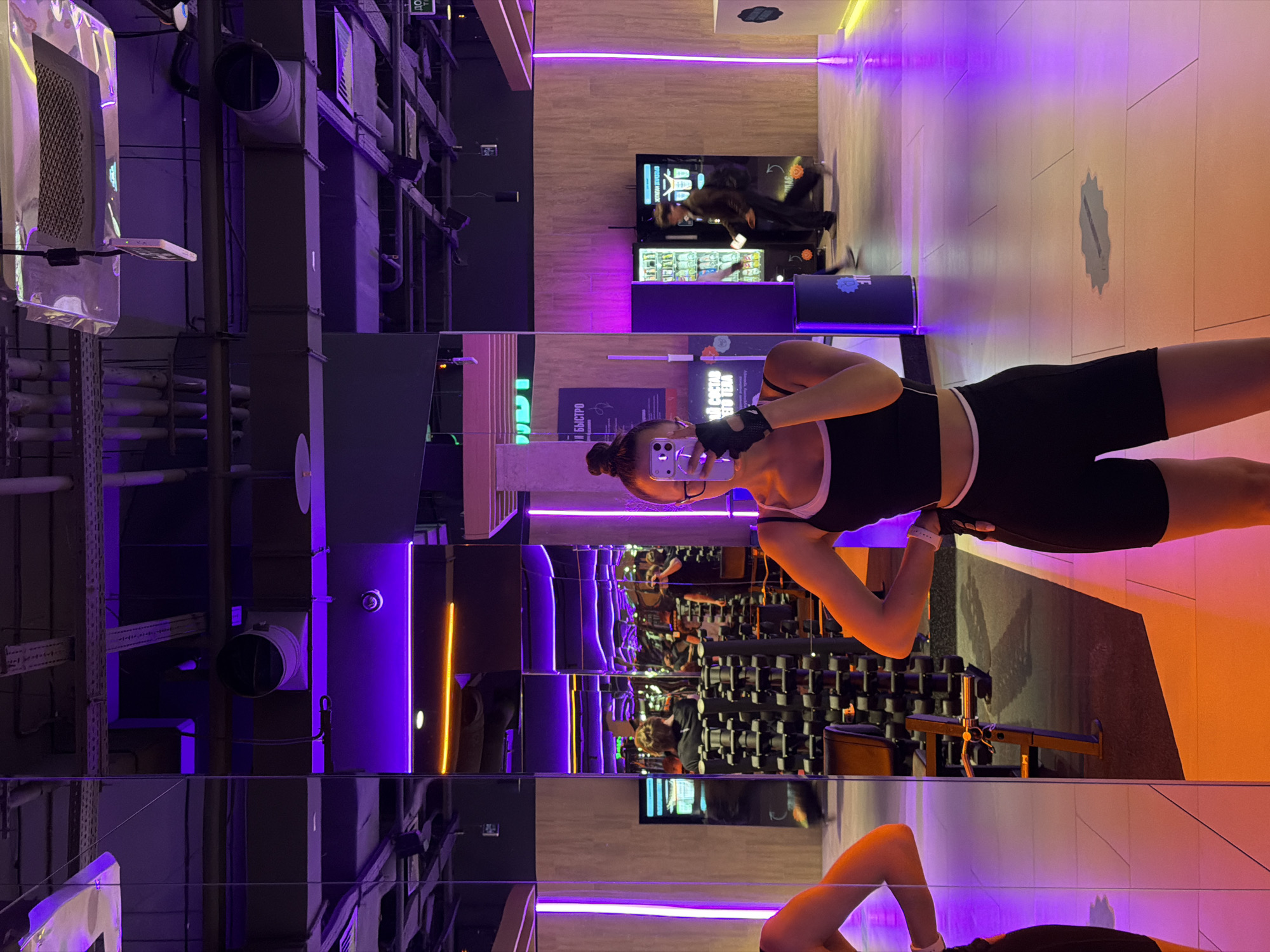 Woman documents workout session at modern Podolsk gym